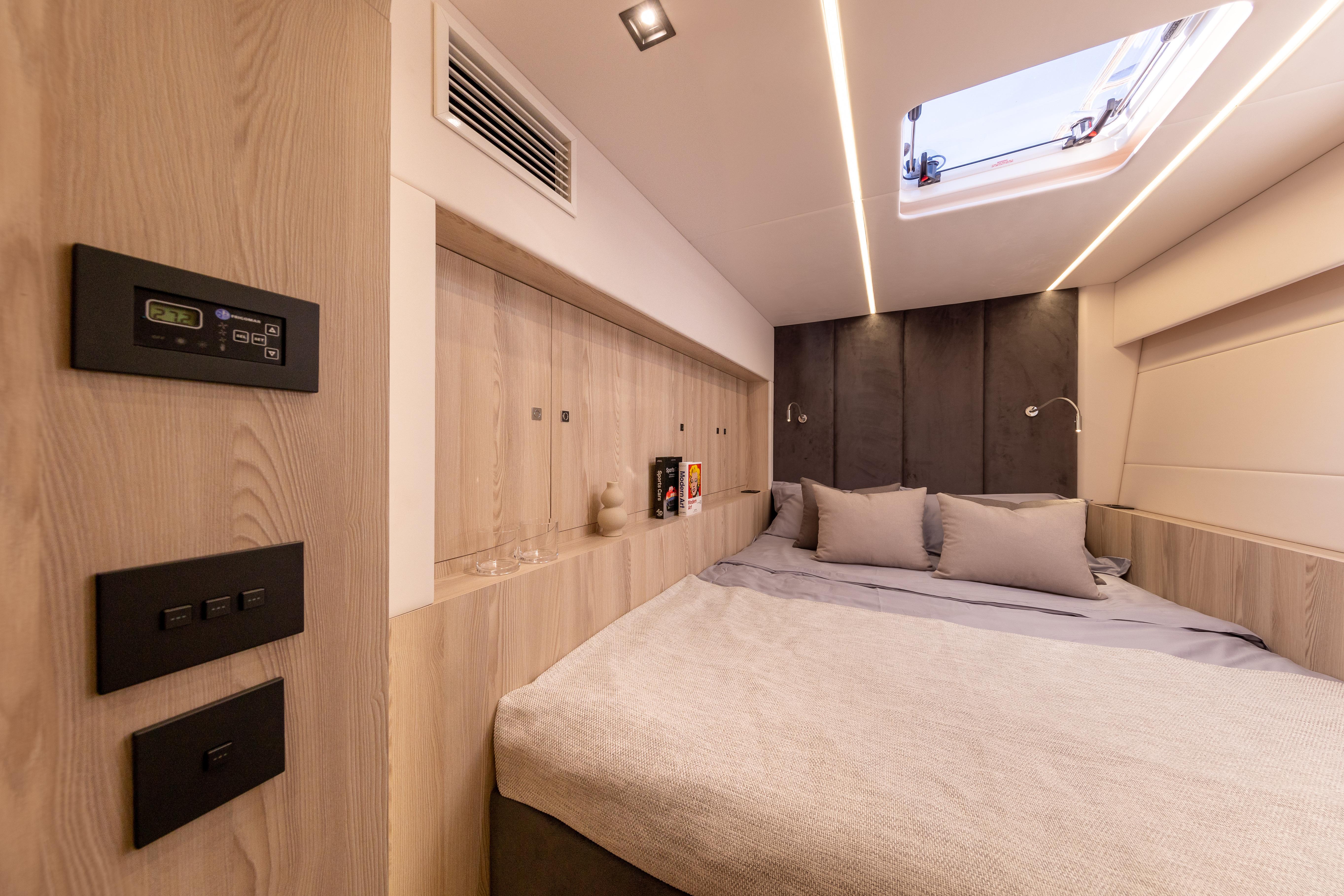 Luxurious Omaya 50 yacht bedroom interior, 2026 model, featuring modern design and ambient lighting.