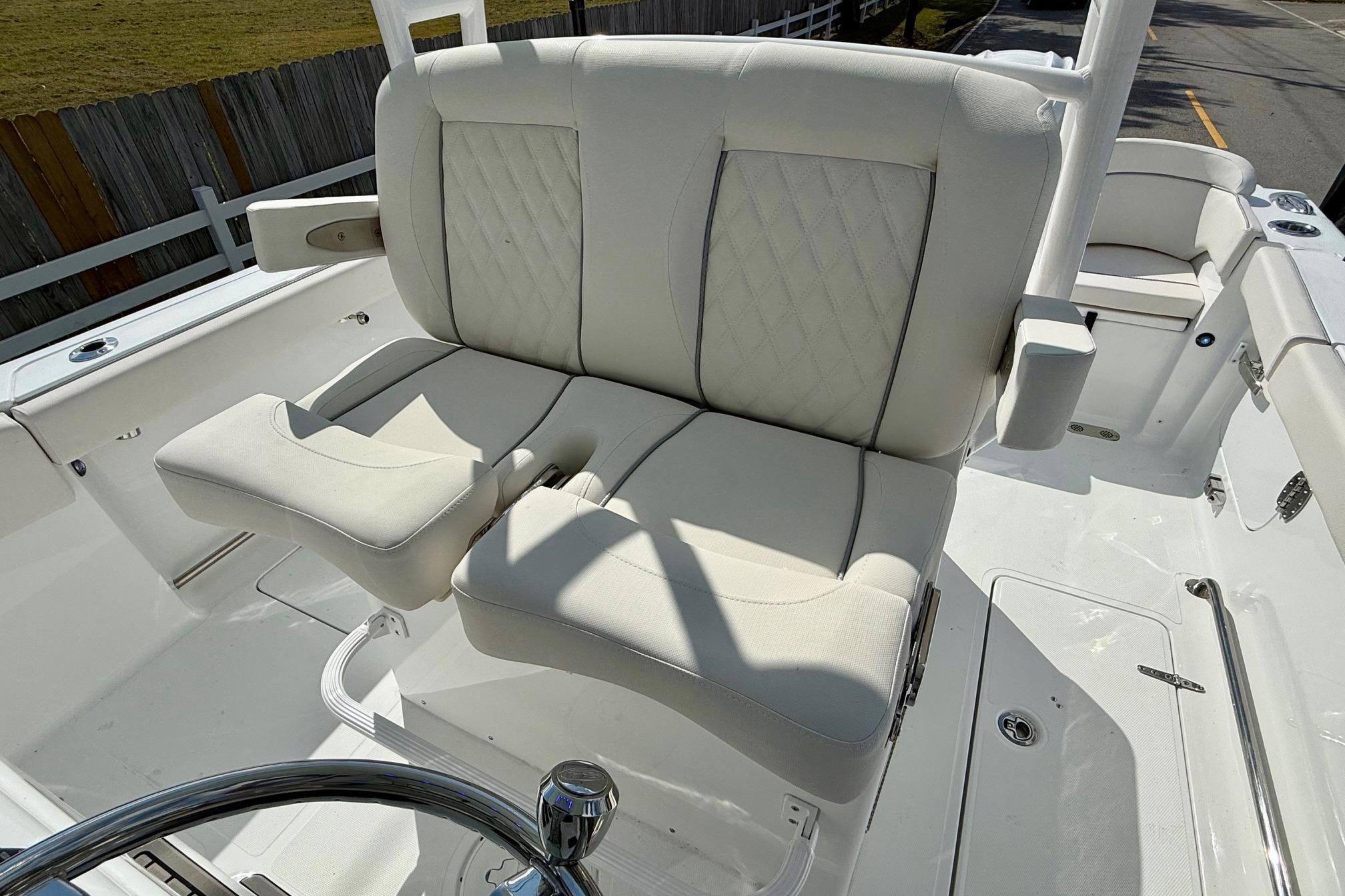 2026 Sea Hunt Ultra 285 Coffin Box boat with luxurious seating and steering wheel.