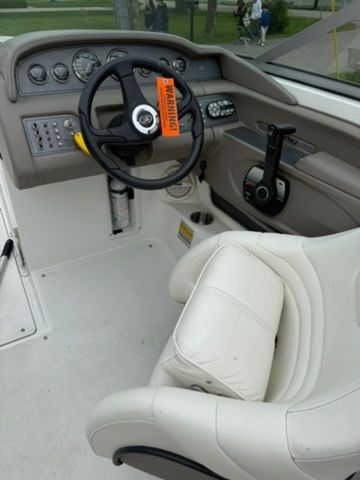 The image shows the cockpit of a 2001 Cobalt 226 boat with a white seat.
