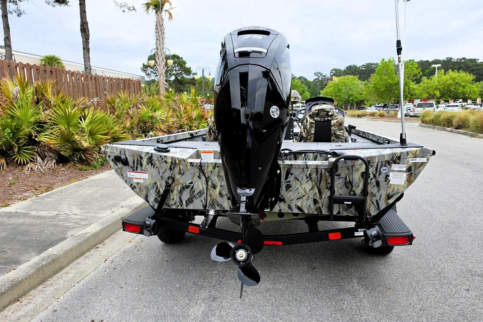 2026 Ranger RT178 boat with camouflage design and powerful outboard motor.
