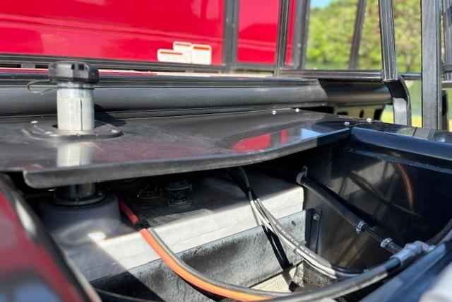 2025 Regency 250 DL3 boat battery compartment with visible wiring and components.