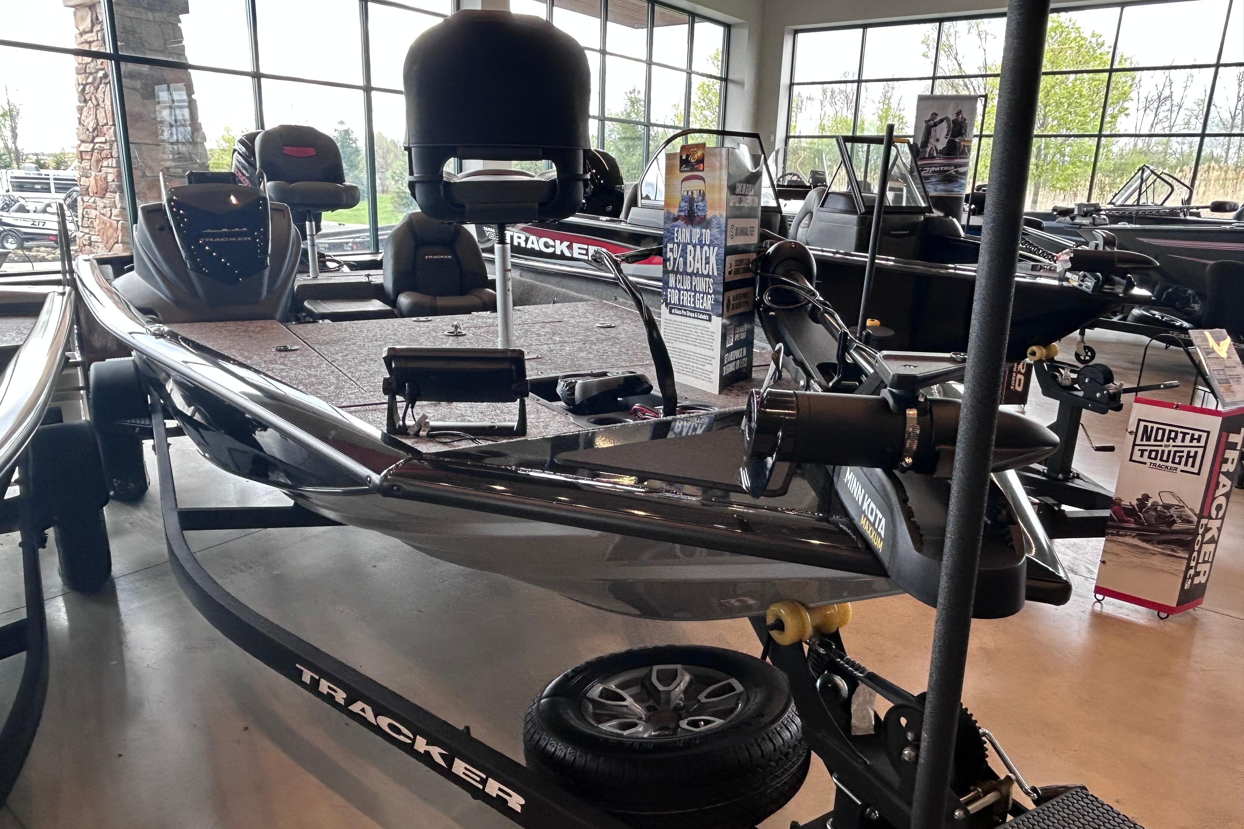 2026 Tracker Pro Team 195 boat displayed in showroom, featuring sleek design and advanced equipment.