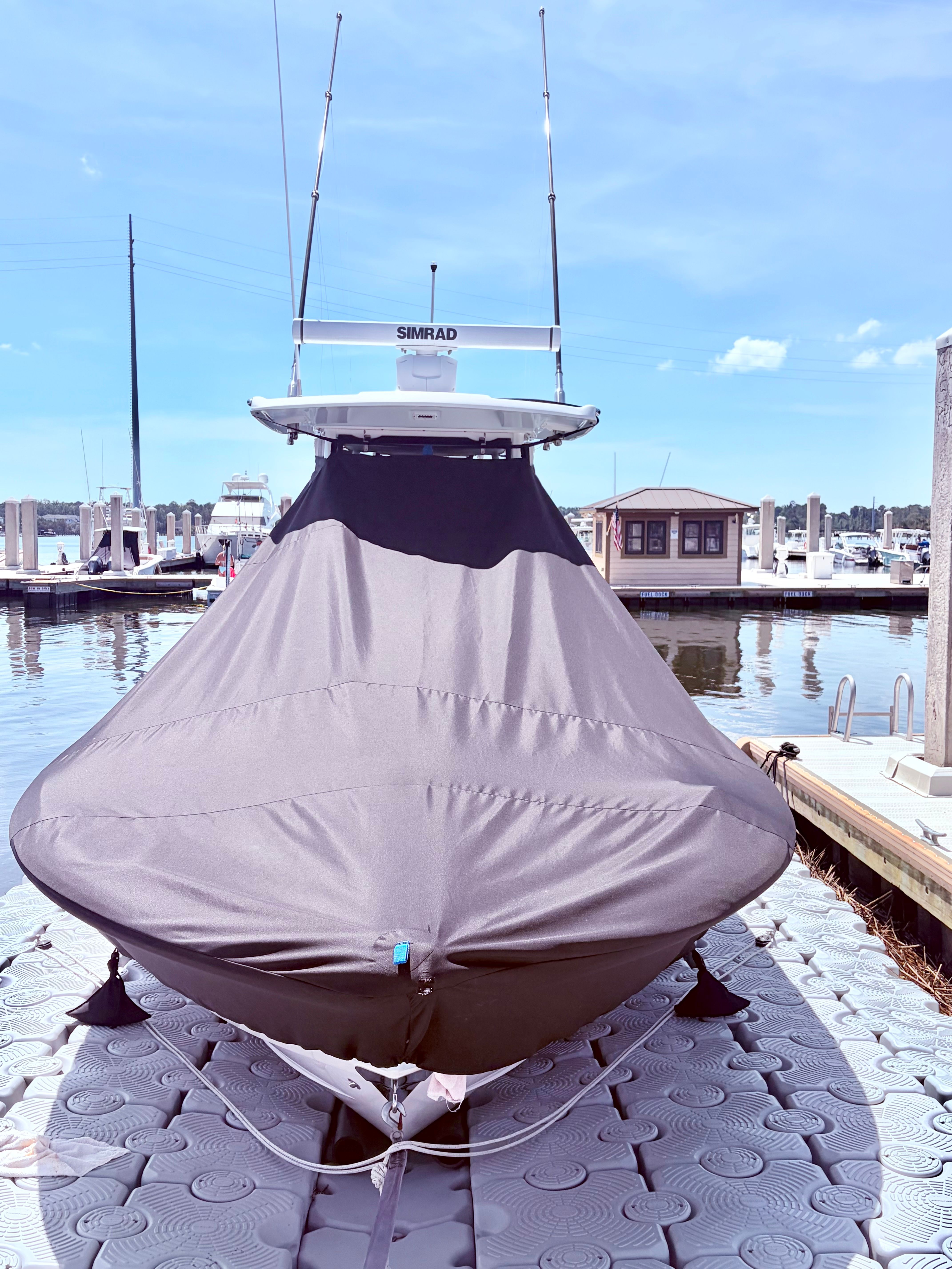 Covered Robalo 266 Cayman boat at dock, year 2025.