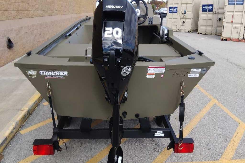 2026 Tracker Grizzly 1648 SC boat with Mercury 20 engine, parked on trailer.