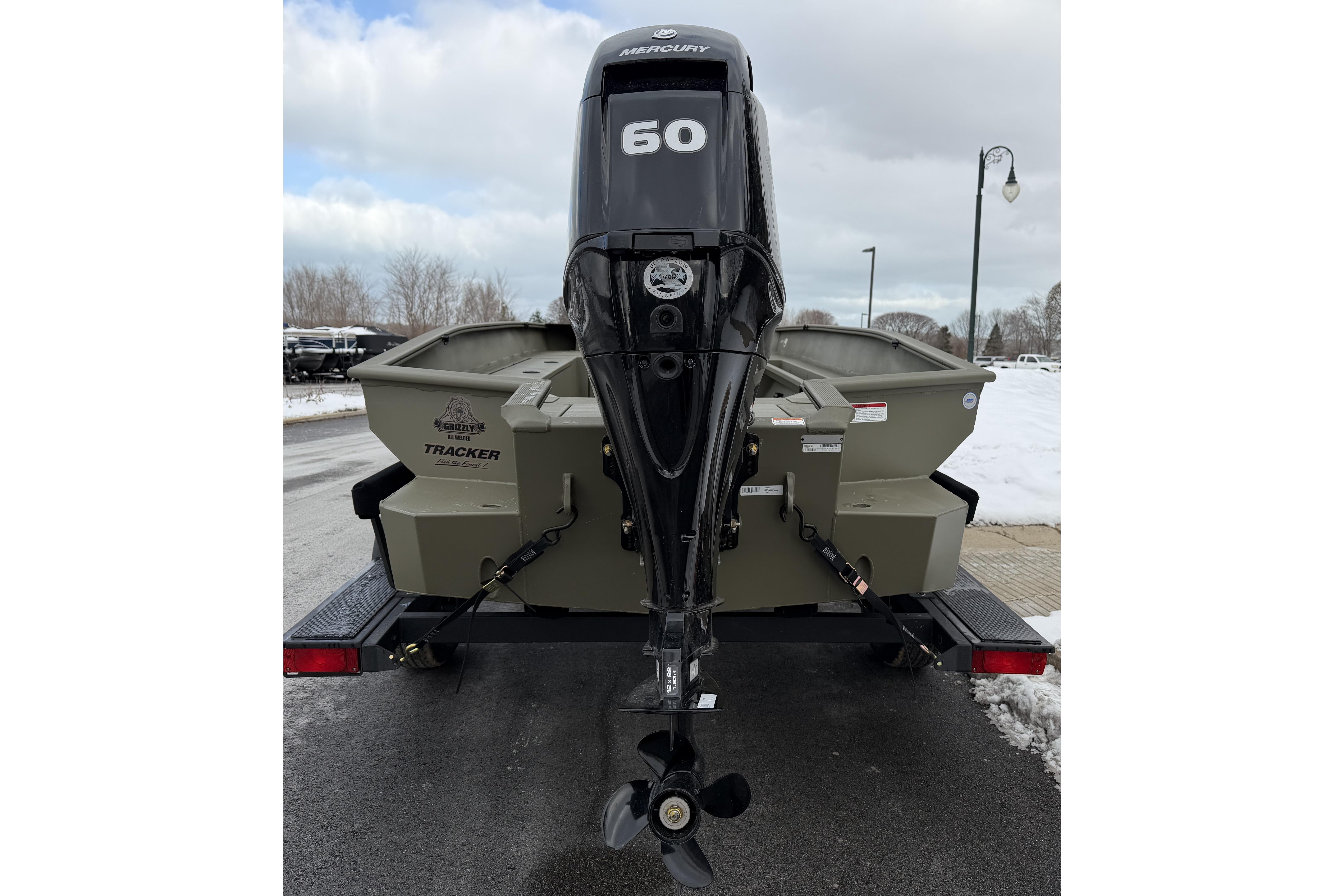2026 Tracker Grizzly 1756 T Marsh boat with Mercury 60 outboard motor on trailer.