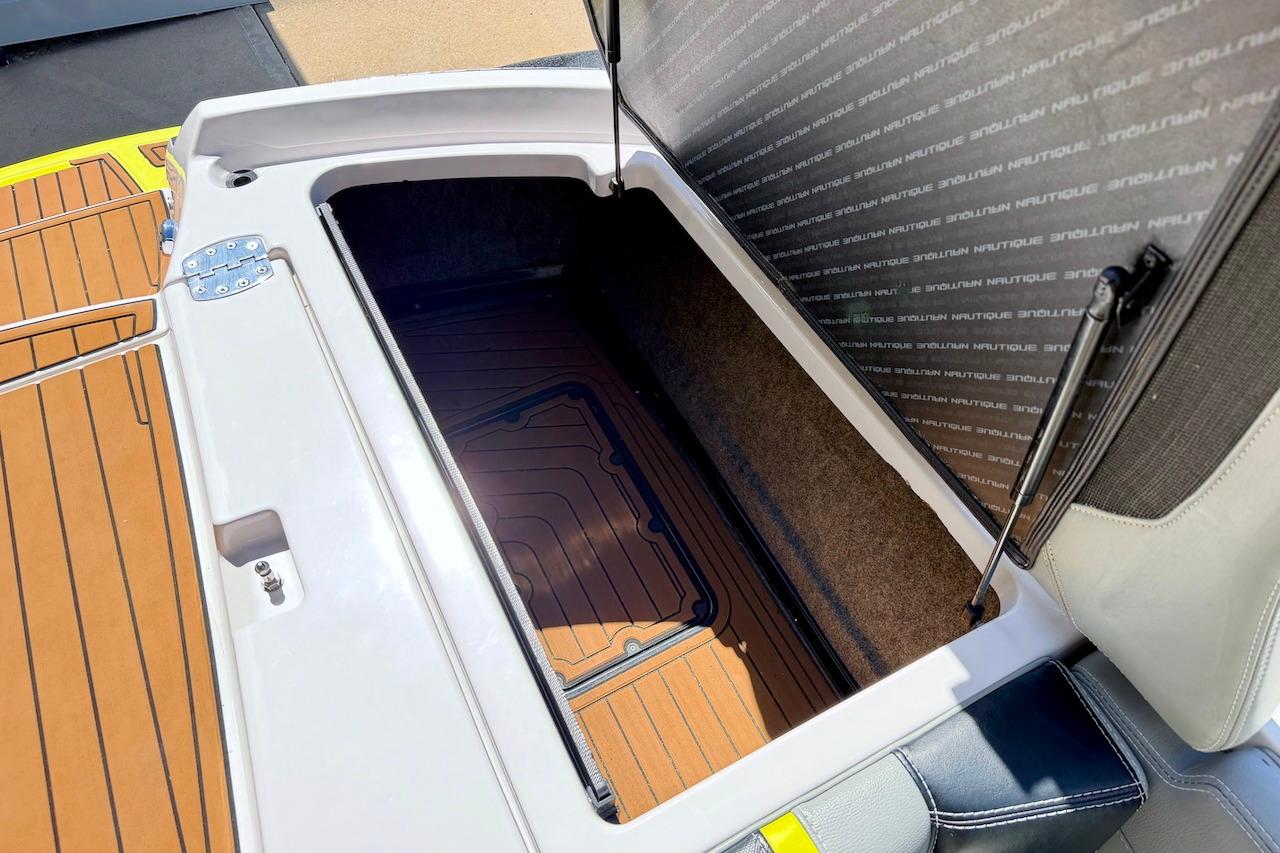 Open storage compartment on 2014 Nautique Super Air Nautique G21 boat.