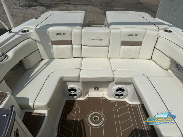 2008 Sea Ray 270 SLX boat interior with white seating and brown flooring.