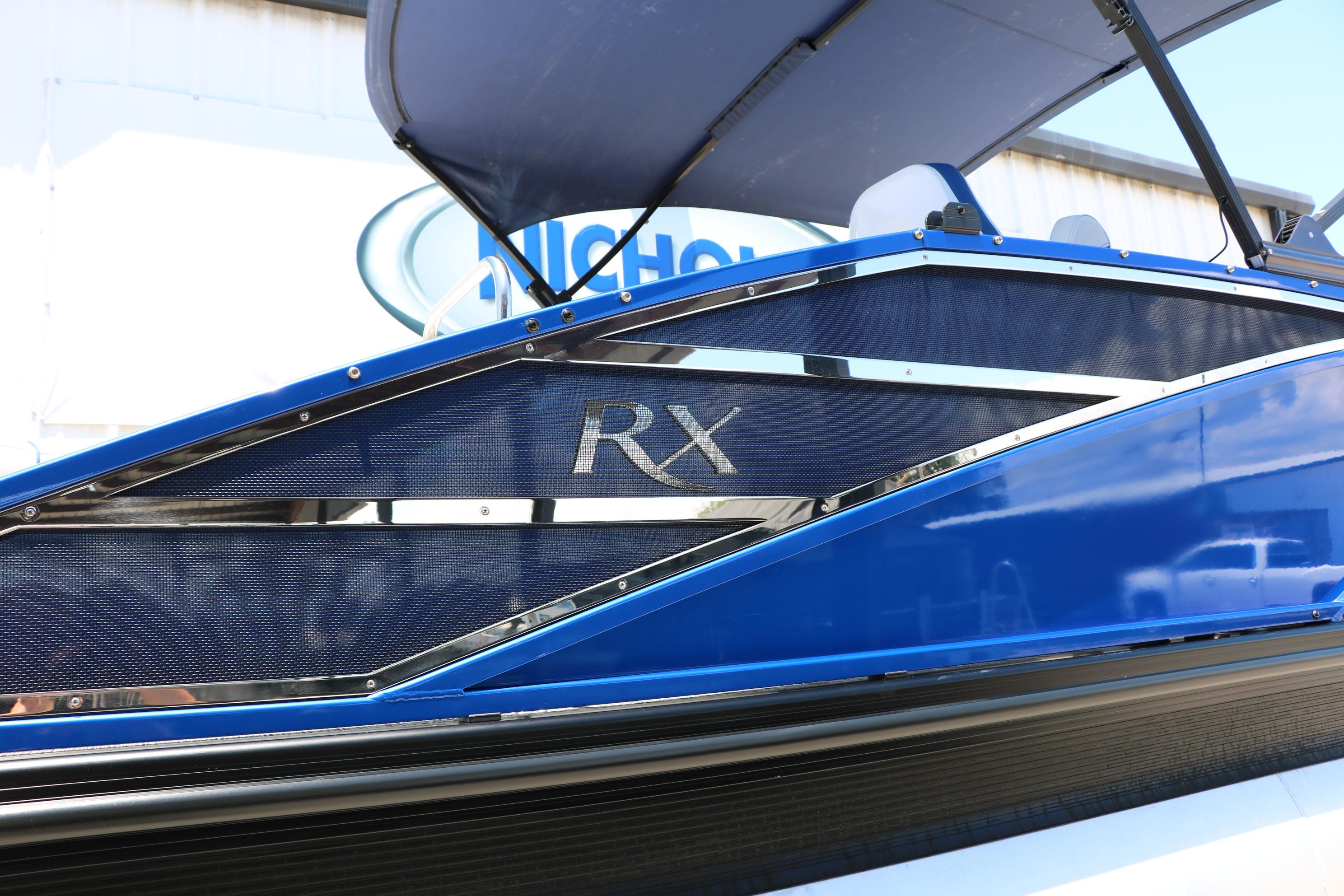 2024 Bennington 23 RX Swingback boat with sleek blue design and RX branding.