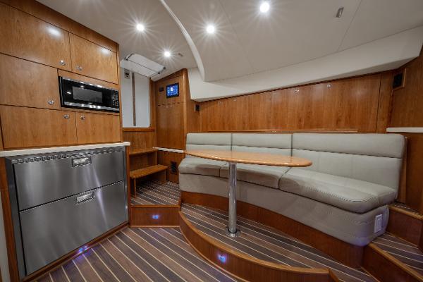 2025 Albemarle 36 Express yacht interior with modern kitchen and cozy seating area.