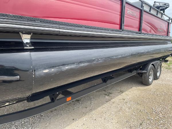 2023 Regency 250DL3 pontoon boat on trailer, side view, red and black design.