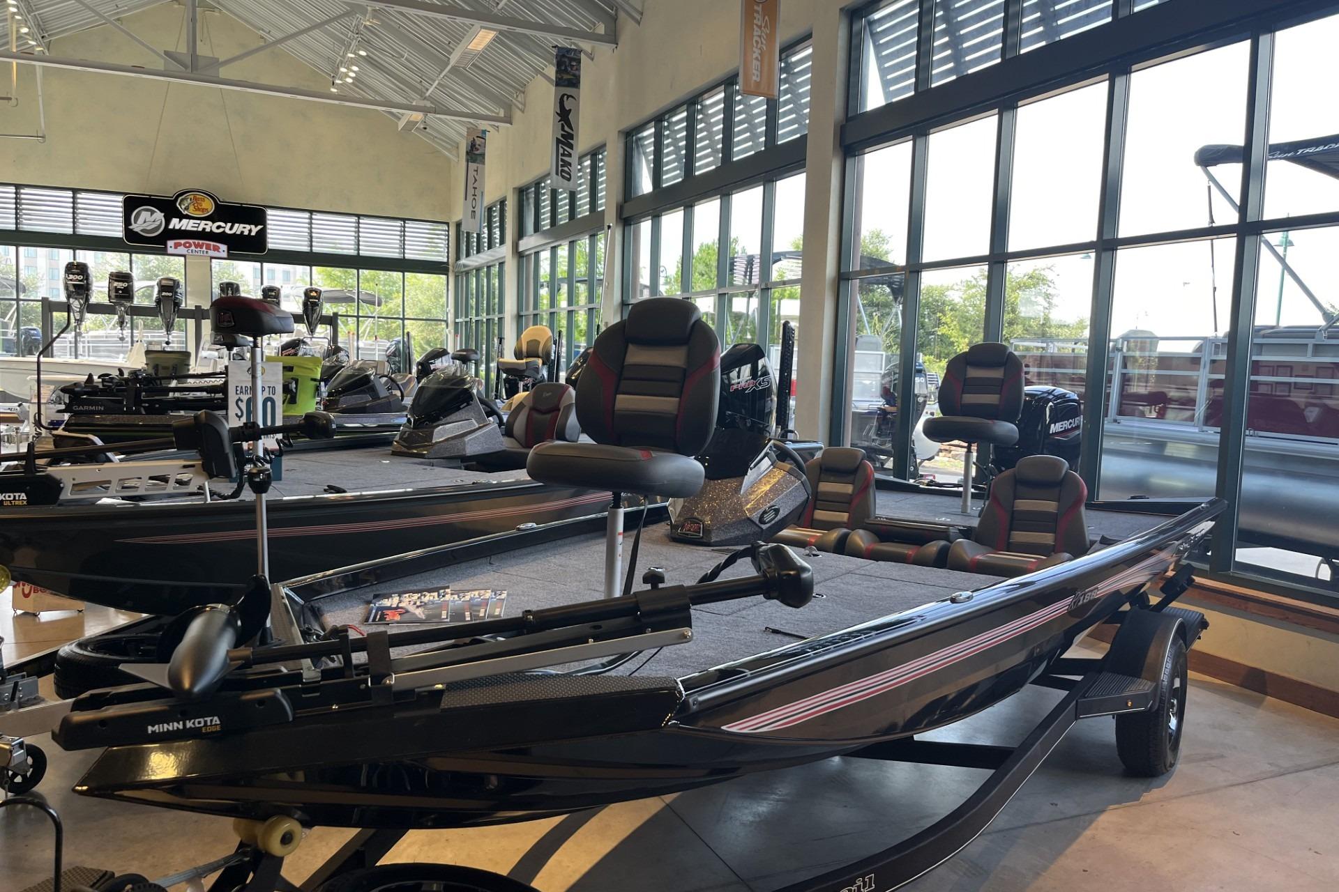 2026 Ranger RT188 boat displayed in a showroom with modern seating and equipment.