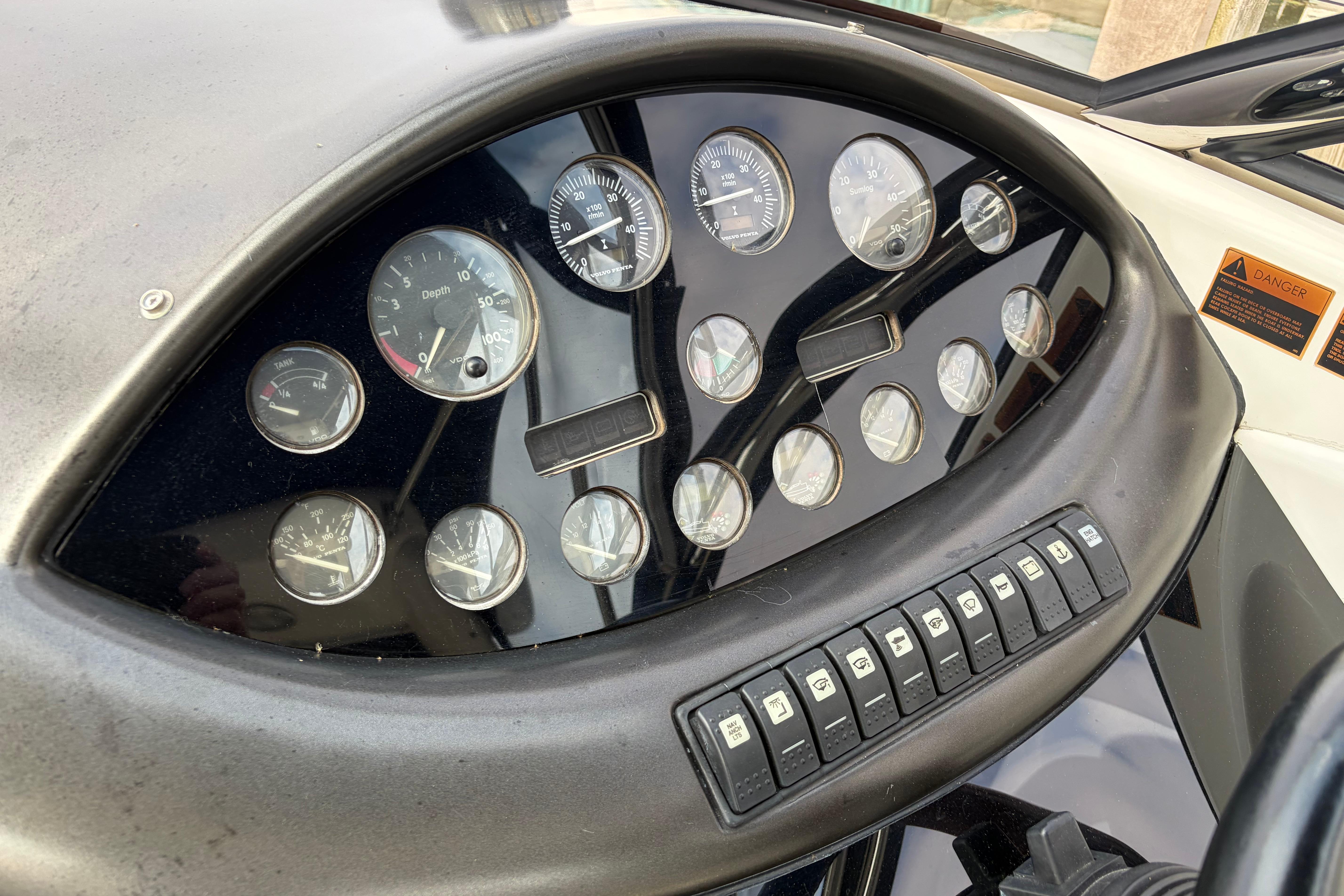 Dashboard of a 2000 Sunseeker Superhawk 34, featuring gauges and control switches.