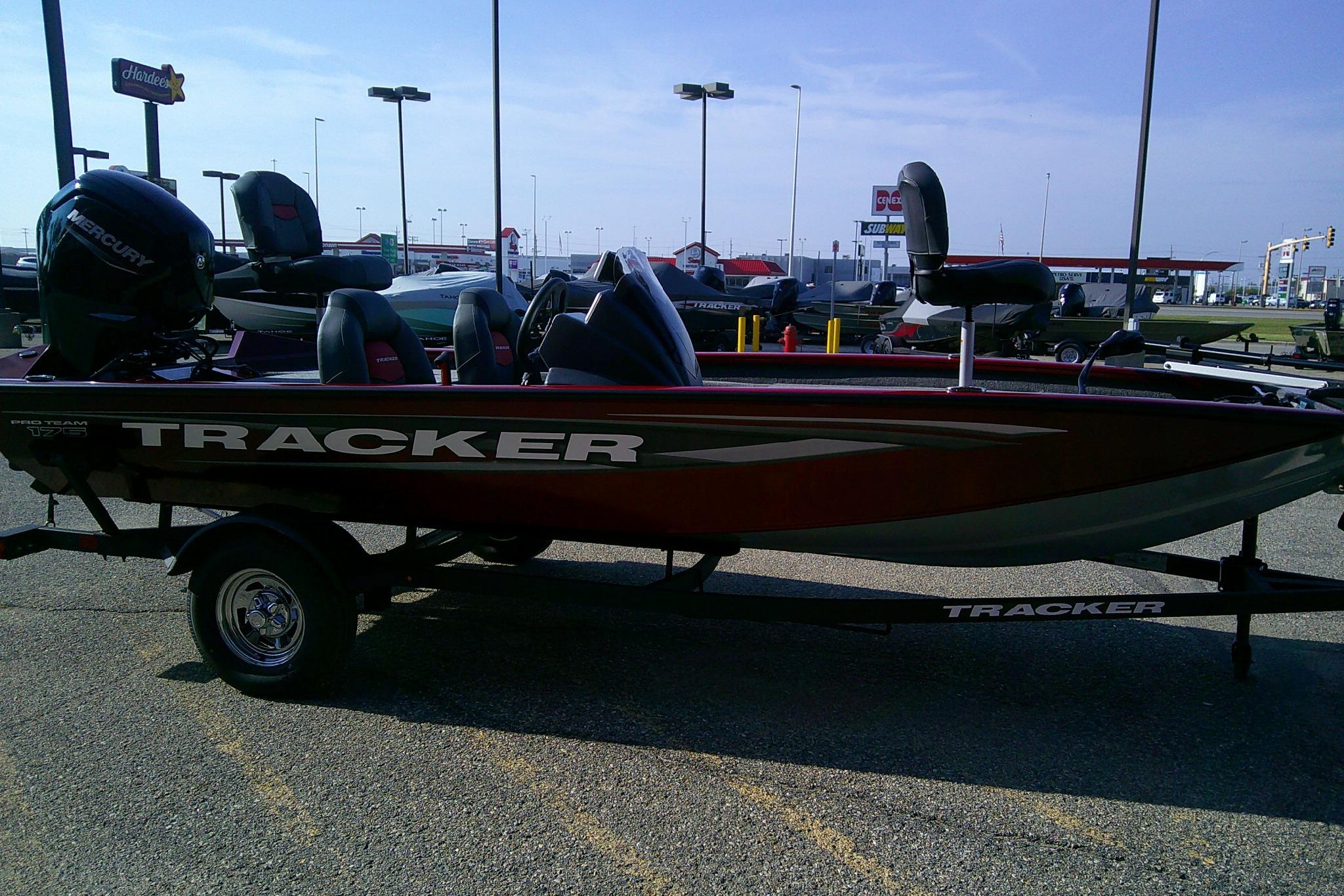 2025 Tracker Pro Team 175 boat on trailer in parking lot.