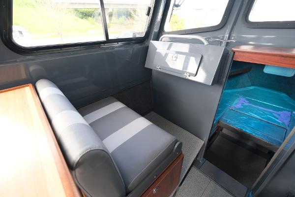 2024 Hewescraft 250 Explorer interior with seating and storage.