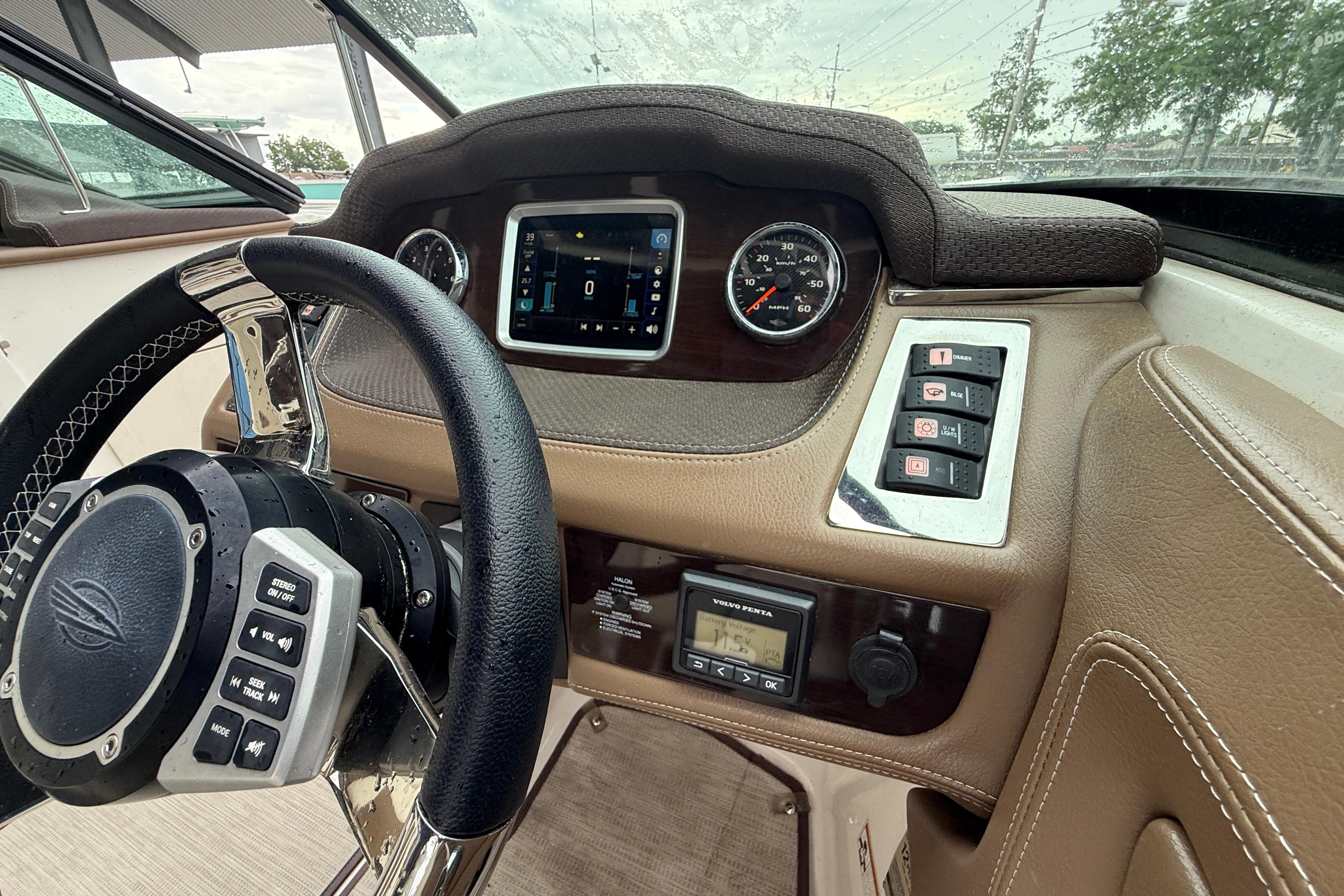 2018 Chaparral 227 SSX Surf dashboard with steering wheel, controls, and digital display.