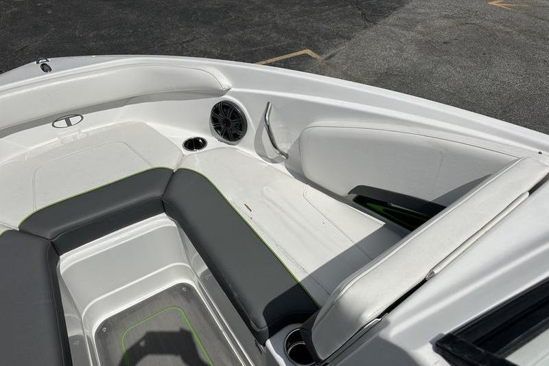 Interior of 2024 Tahoe 210 S boat with sleek seating and speaker system.