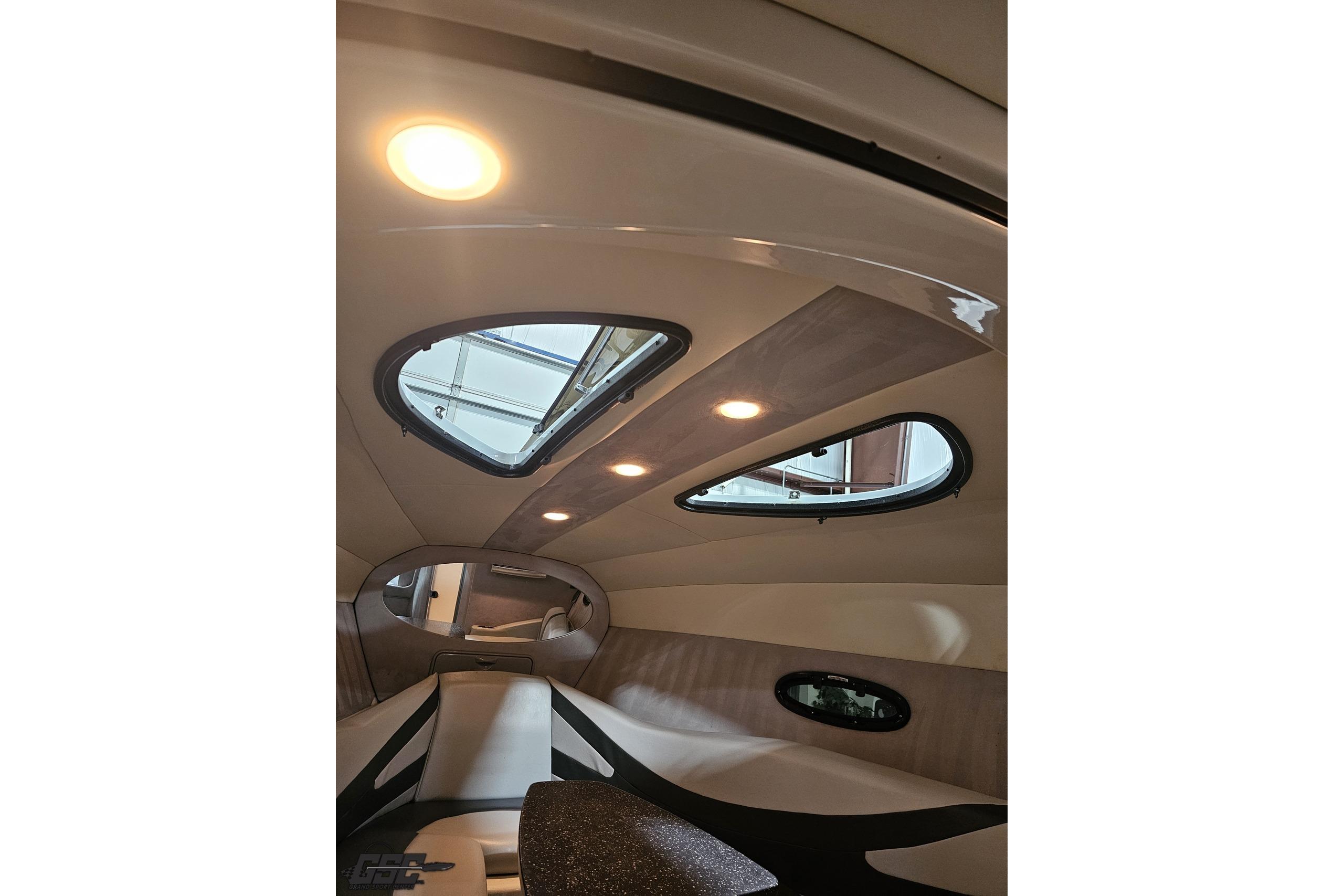 Interior cabin of 2008 Baja 335 Performance boat with modern lighting and sleek design.