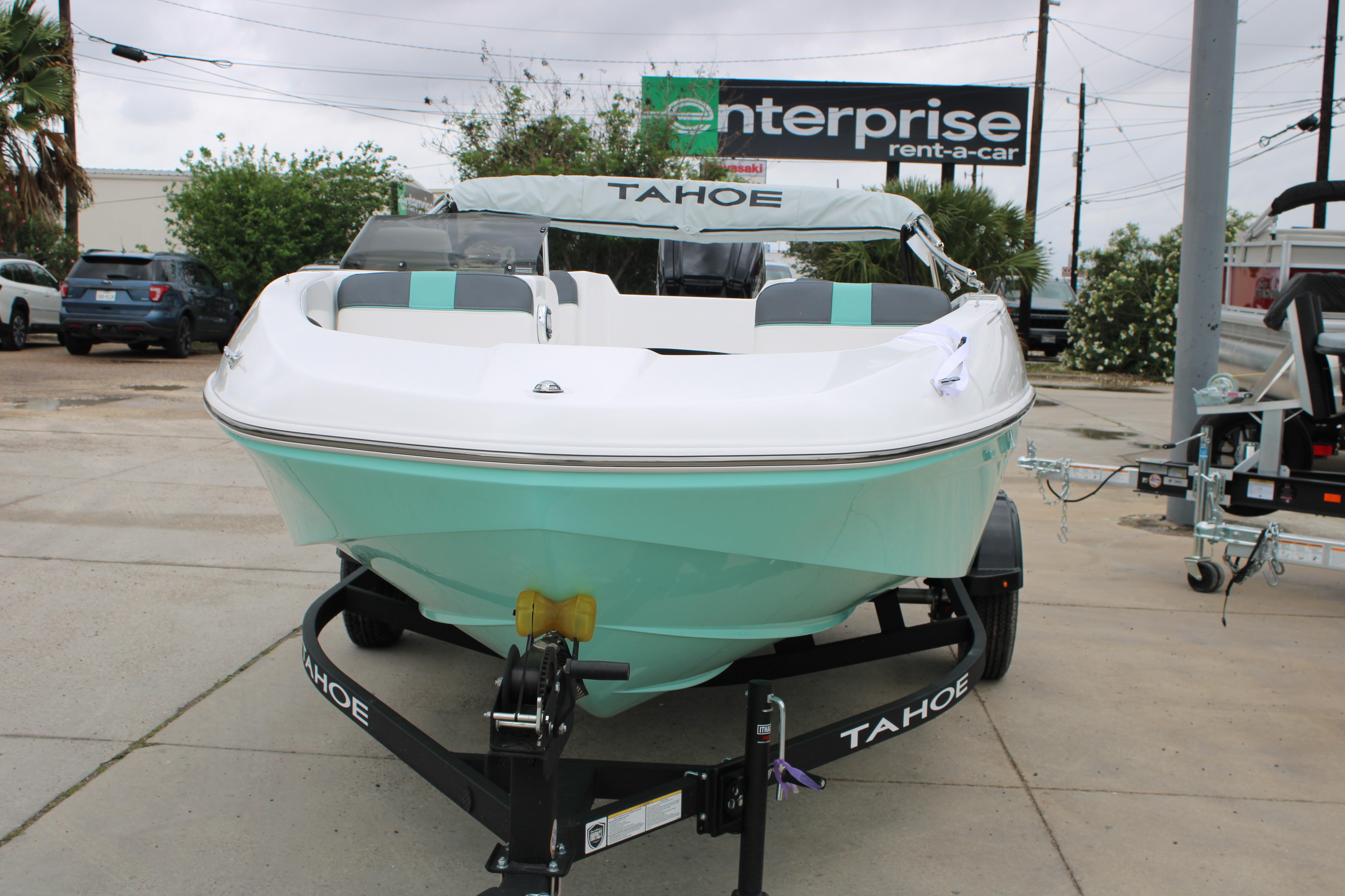 2026 Tahoe T16 boat on trailer at Enterprise Rent-A-Car location.