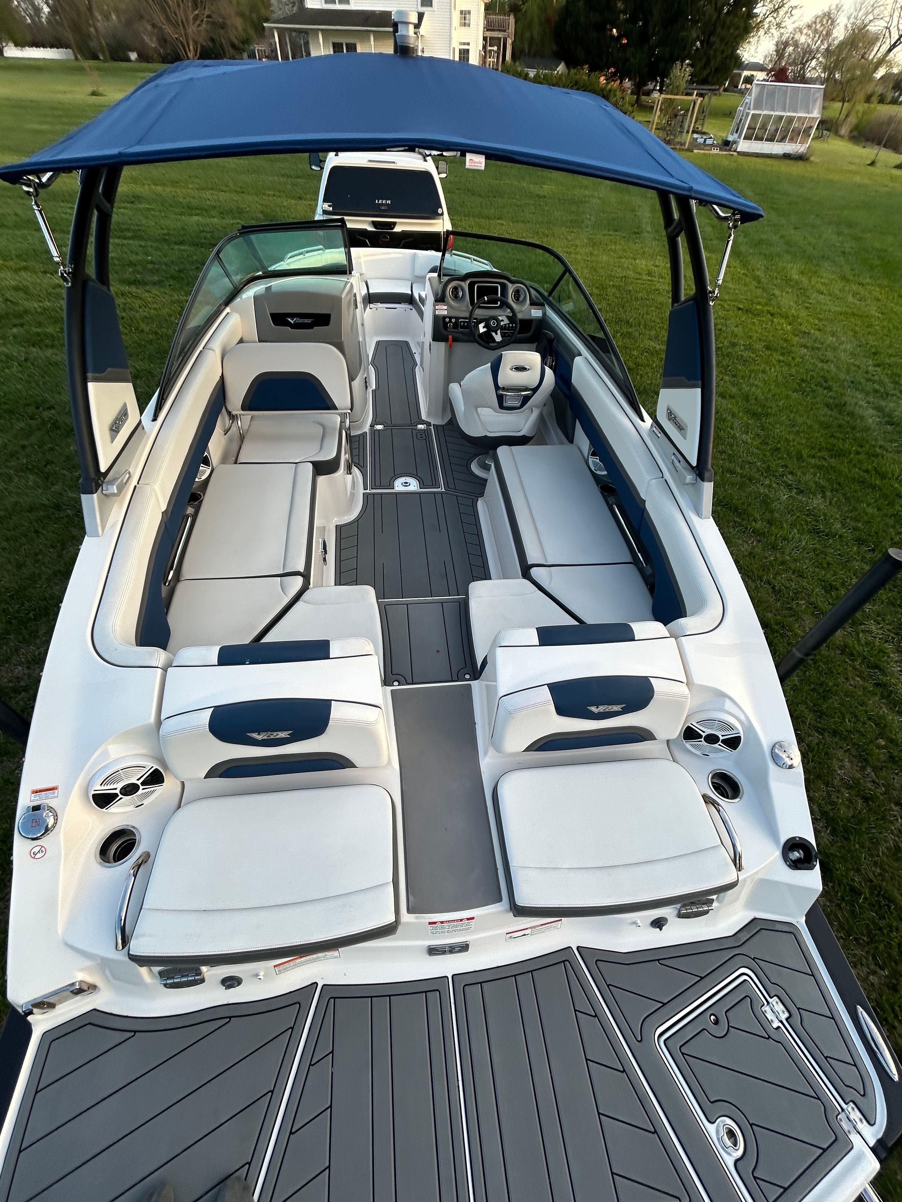 2015 Chaparral Vortex 243 VRX boat with blue and white seating.