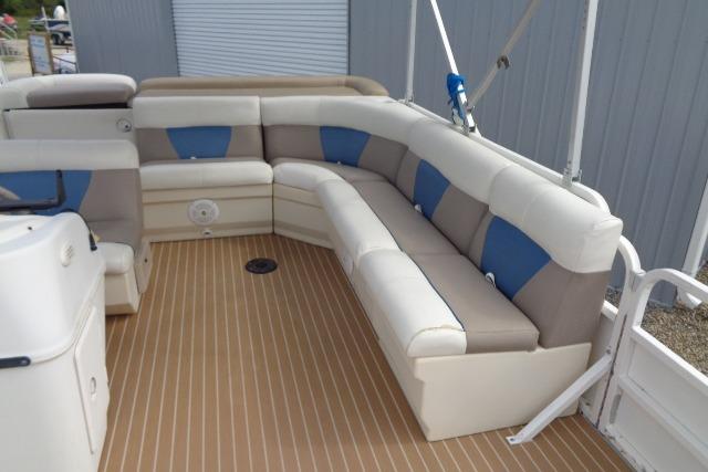2008 Bentley Pontoons 200 CRUISE interior with beige and blue seating on a wooden deck.
