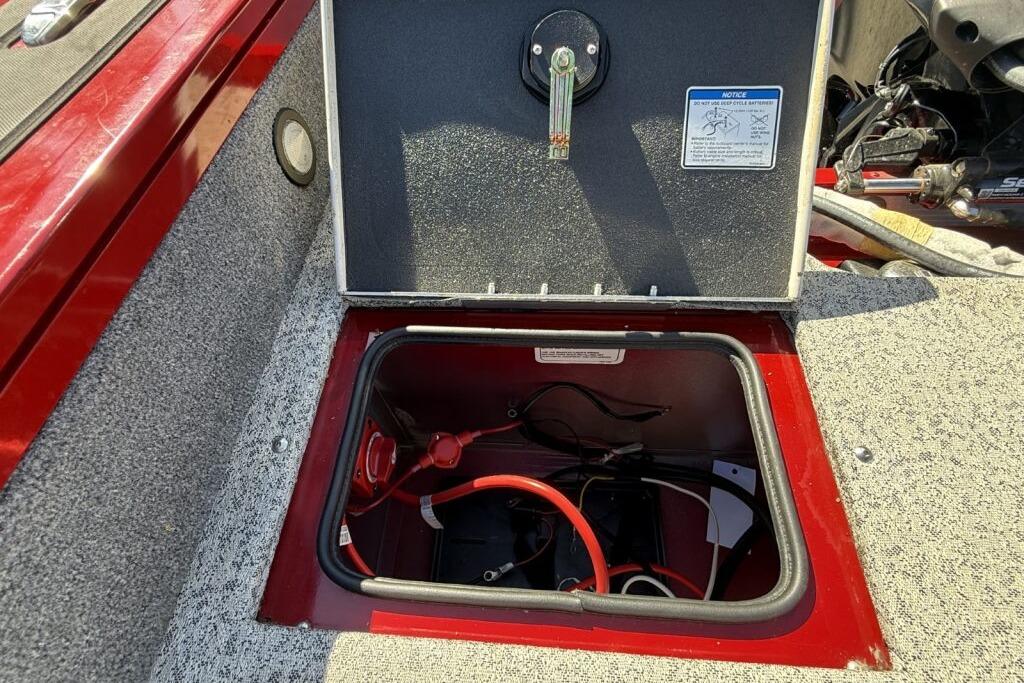 2024 Tracker Targa V-19 WT boat battery compartment with open hatch and visible wiring.