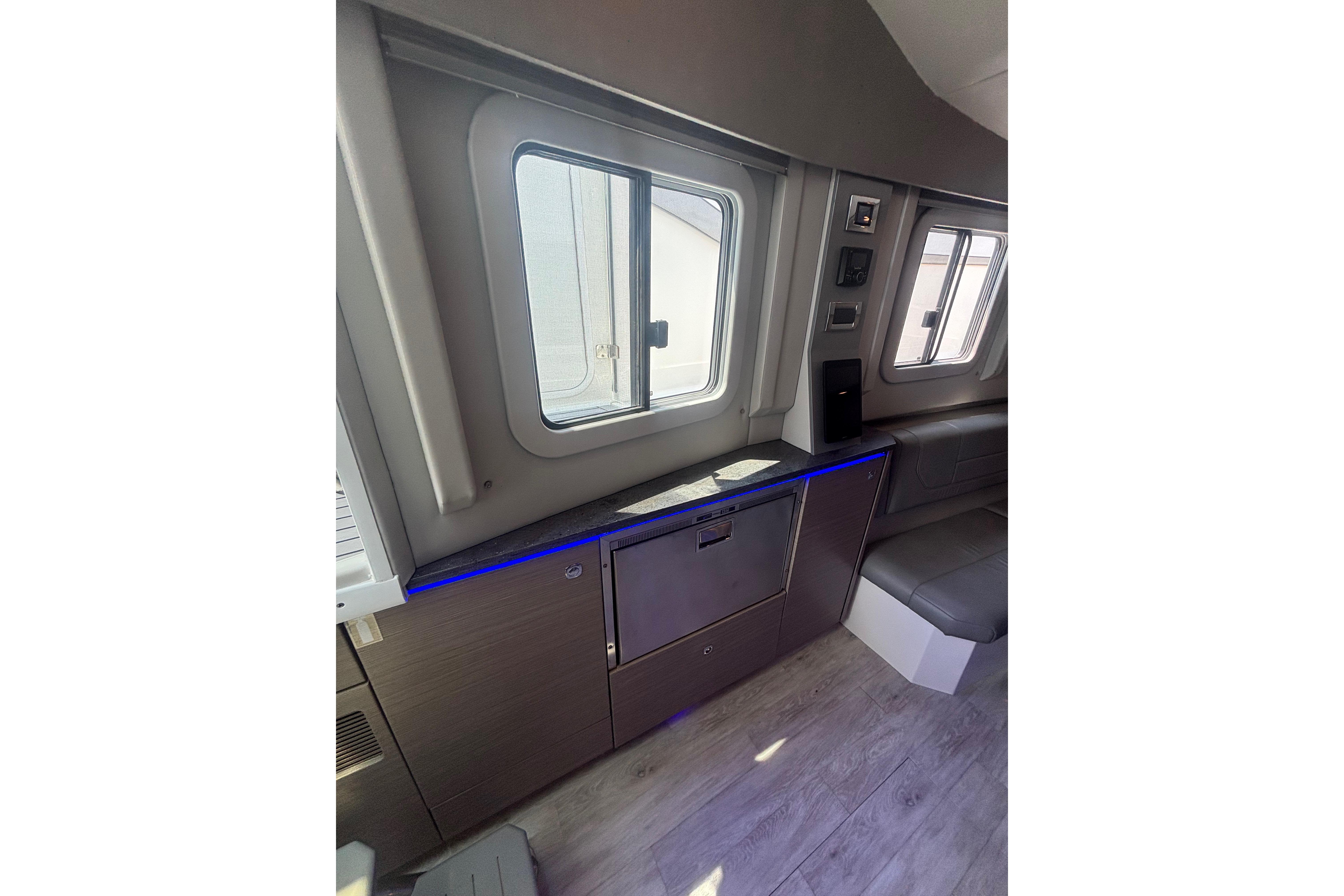 Interior of 2019 Formula 430 Super Sport Crossover with modern seating and cabinetry.