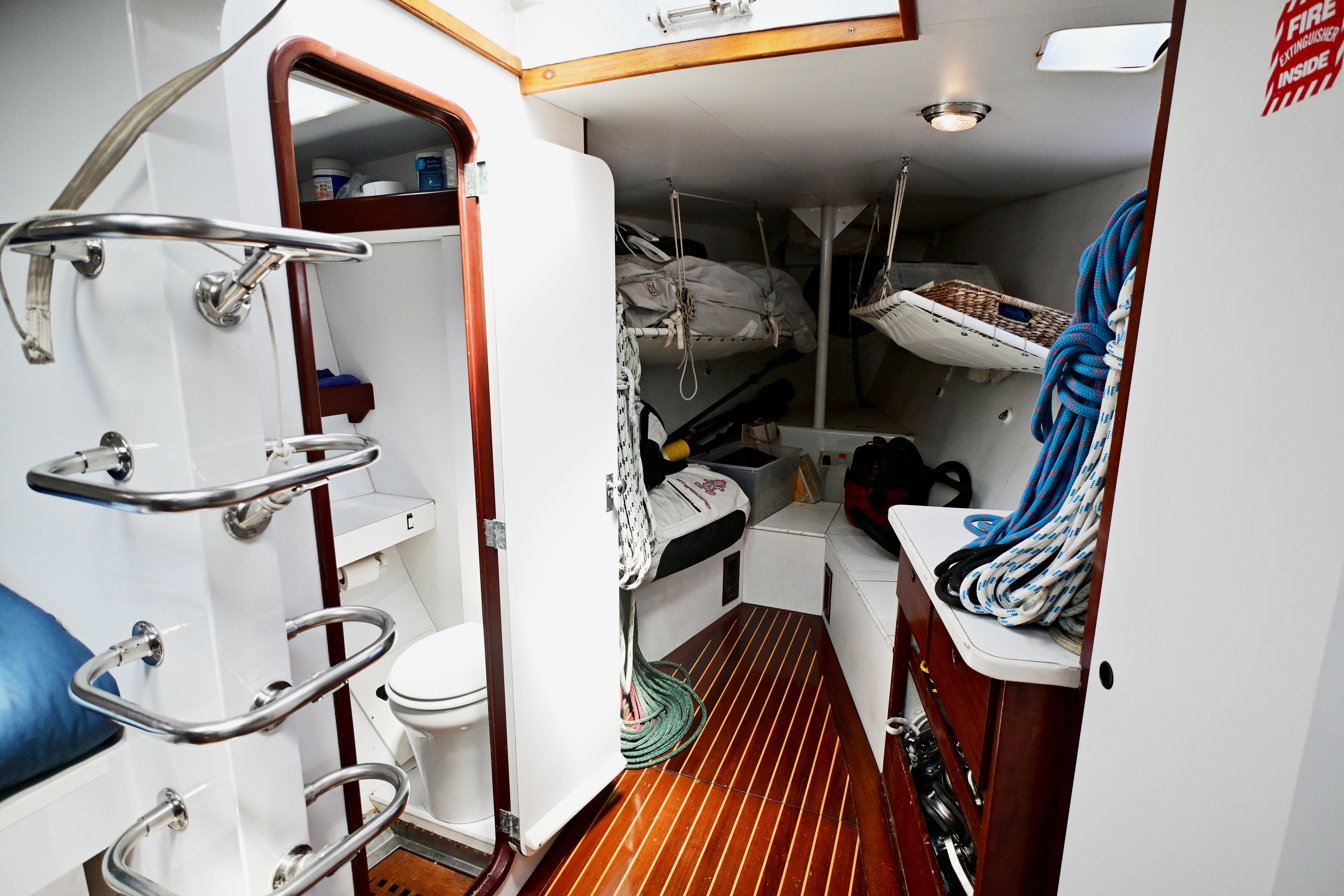 Interior of 1968 Abeking & Rasmussen Tripp 74 yacht with ropes and wooden flooring.