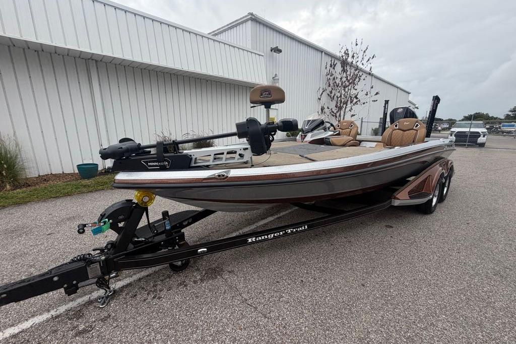 2026 Ranger Z520R fishing boat on trailer, parked outdoors near a white building.