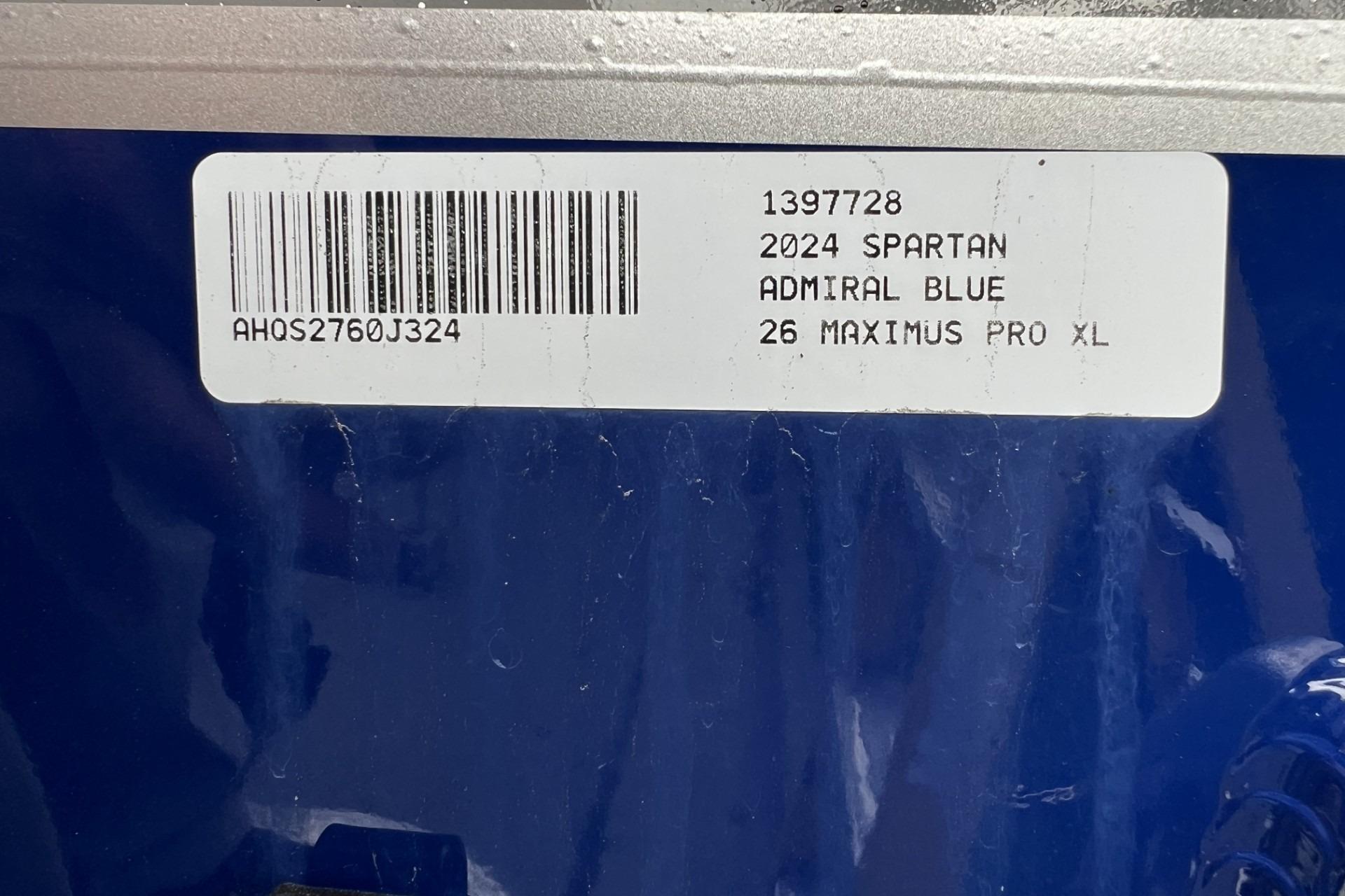 Label on blue surface showing 2024 Spartan 26 Maximus Pro XL details.