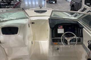 2022 Robalo R247 Dual Console boat interior with steering wheel and dashboard.