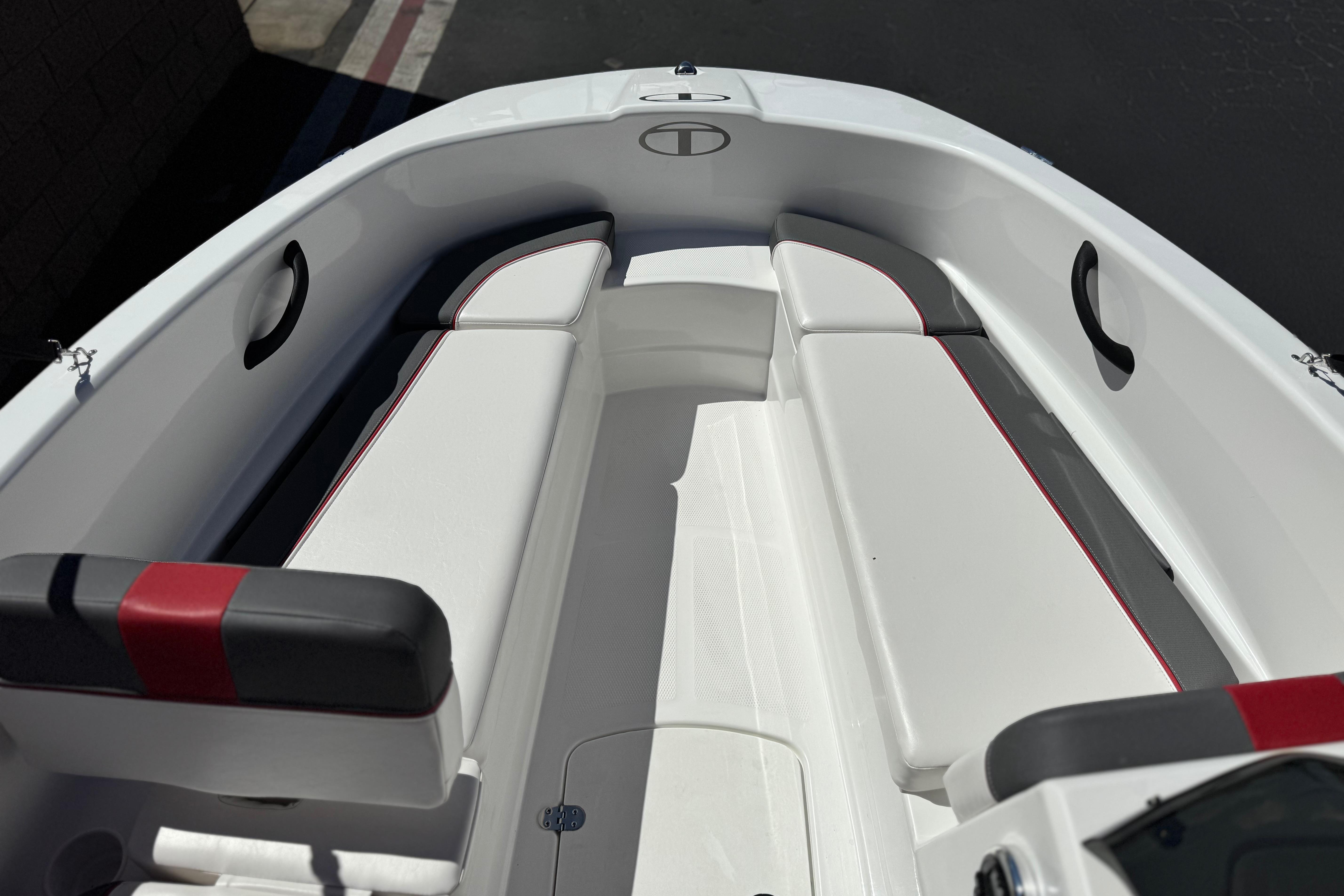 2024 Tahoe T16 boat interior with white seating and red accents.