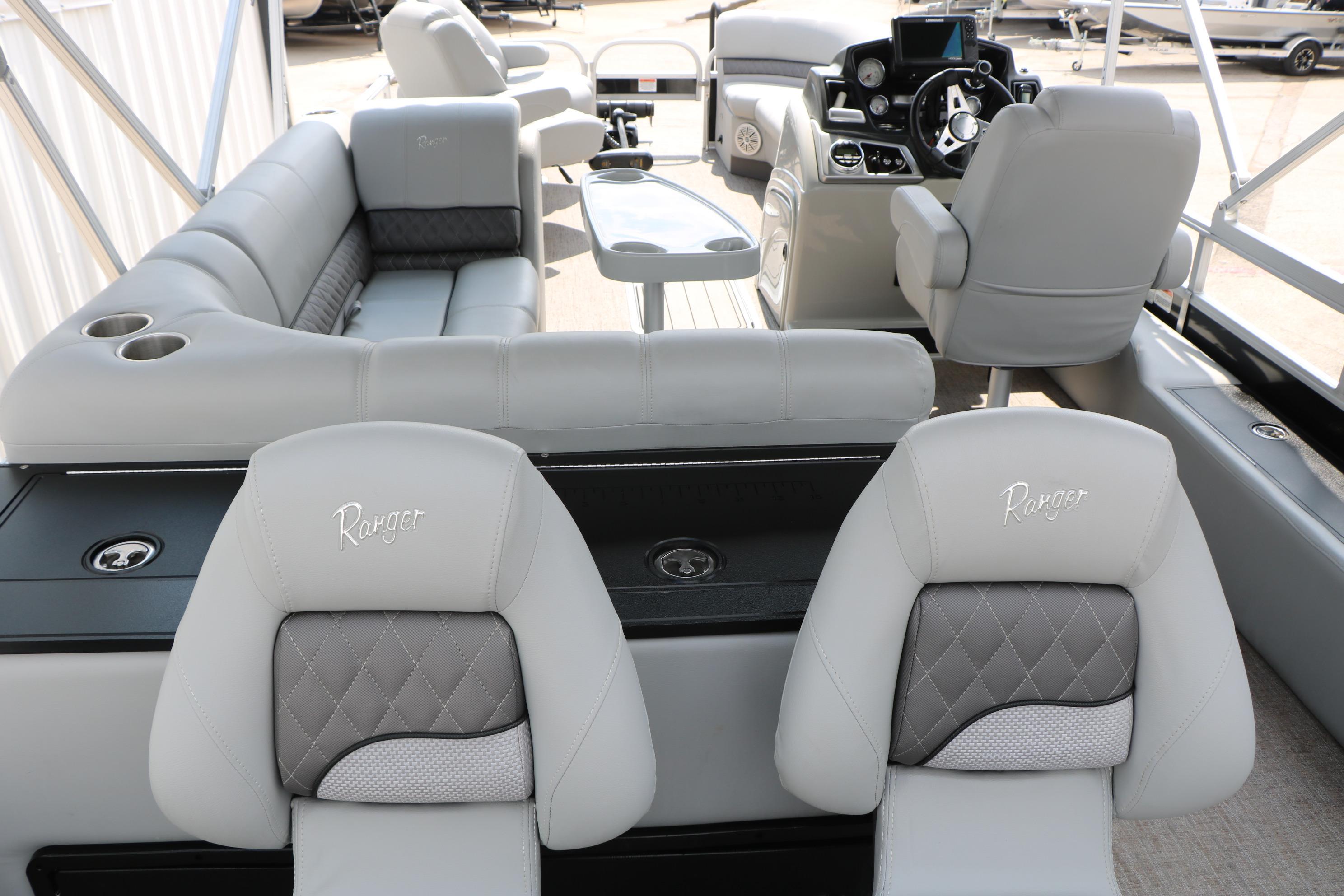 Interior of 2021 Ranger 223FC boat with luxurious seating and modern dashboard.