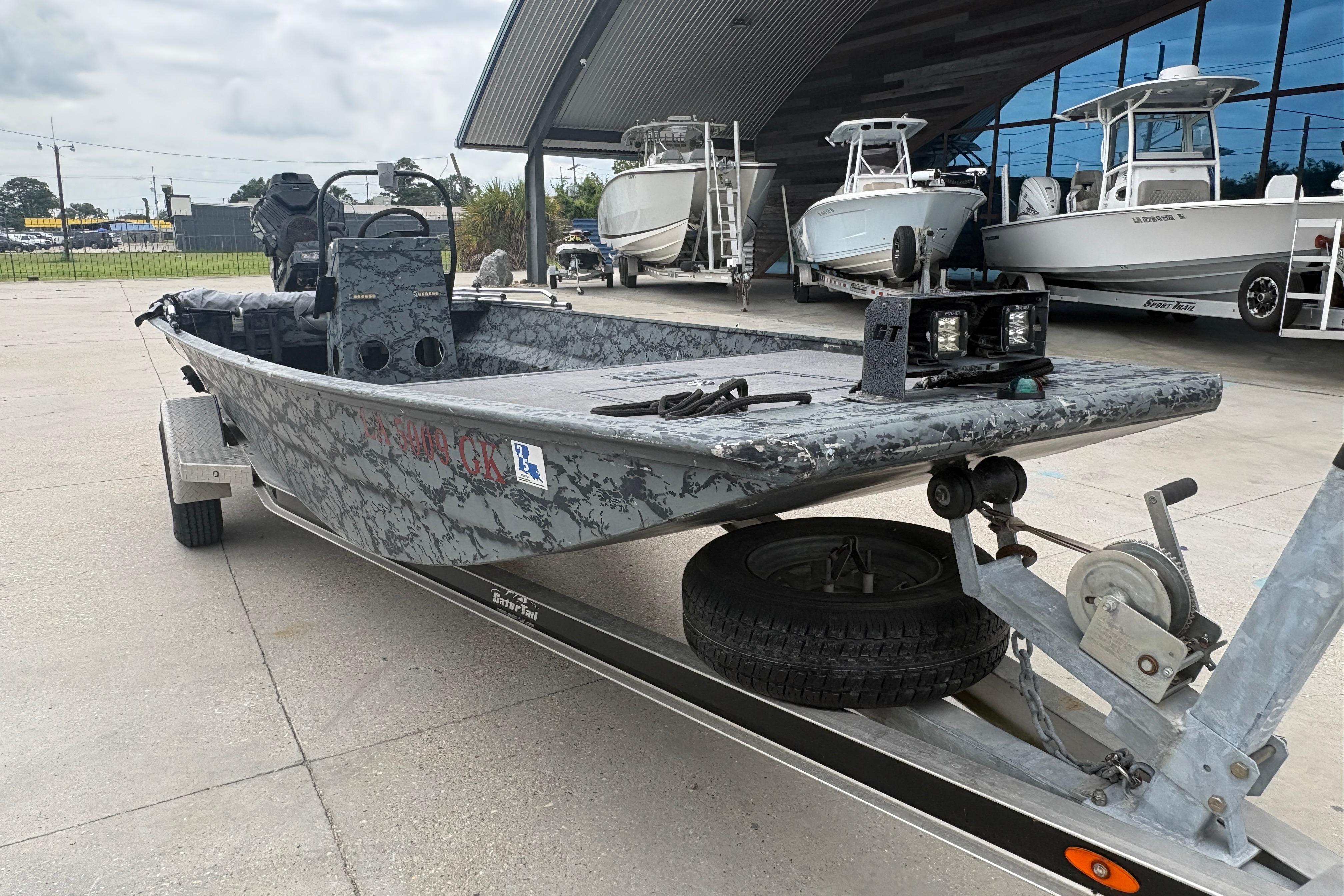 2020 Gator Tail Extreme boat on trailer, parked outdoors near other boats.