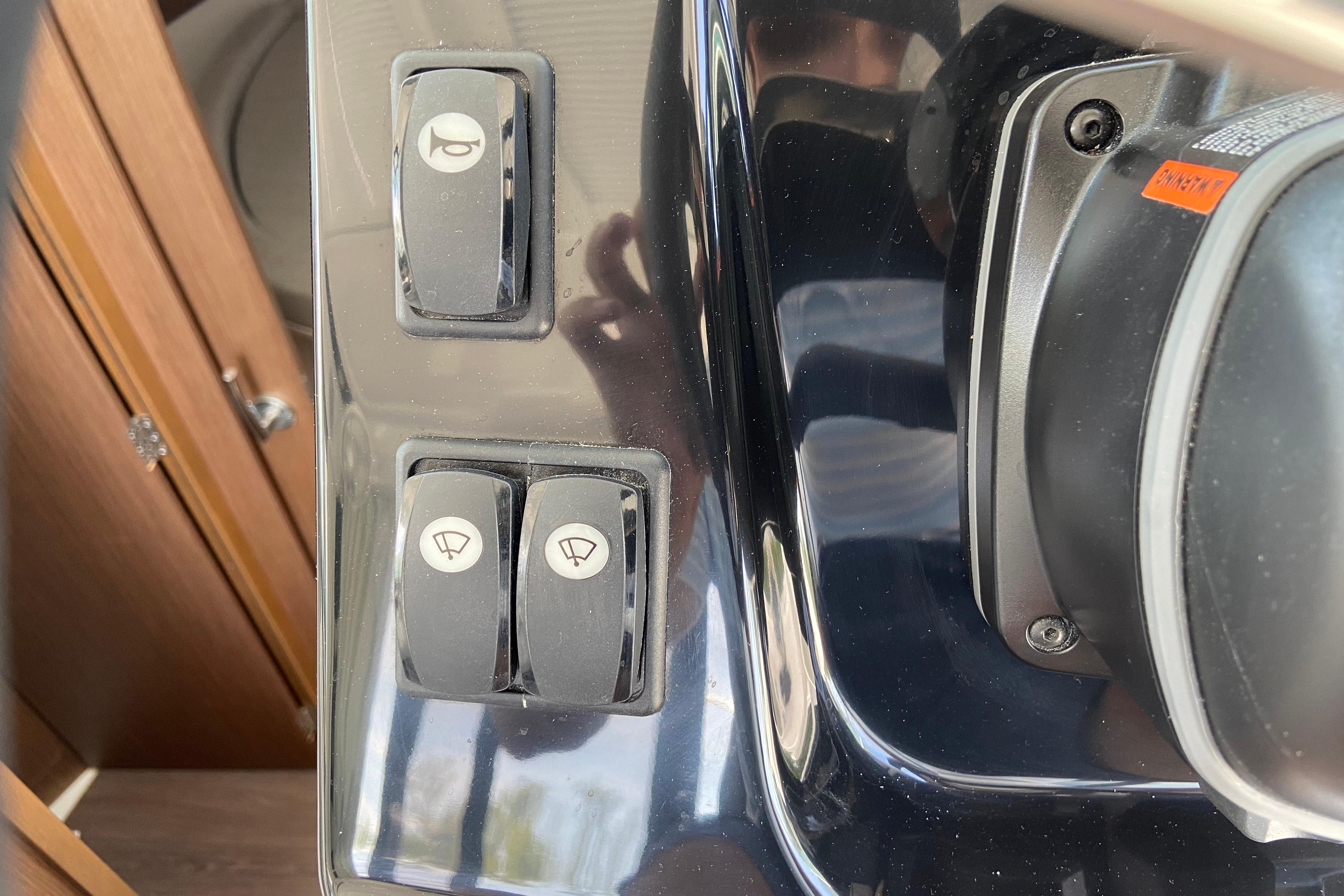 Control panel of 2024 Jeanneau NC Weekender 895 Series 2 boat with switches.