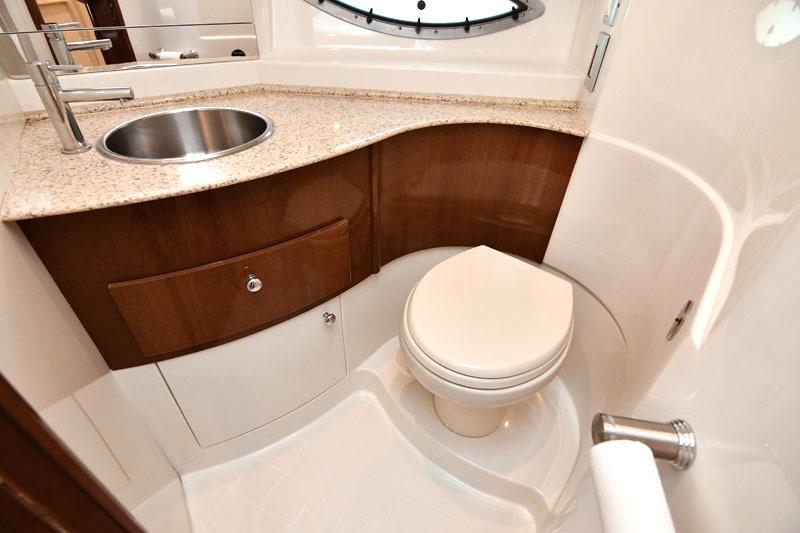 Luxurious bathroom in 2008 Carver 43 Super Sport yacht with modern fixtures and elegant design.