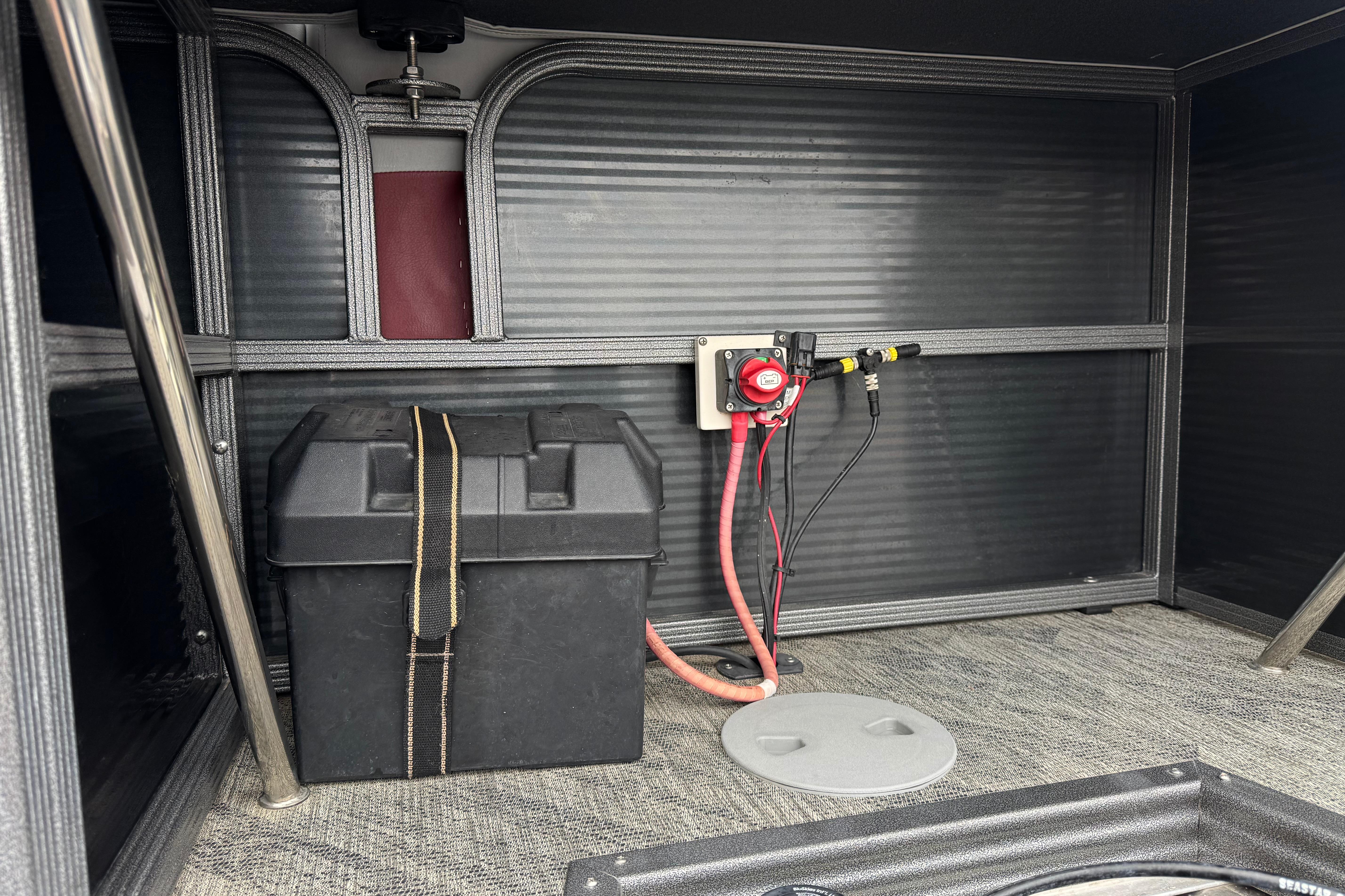 2020 Manitou 18 Aurora LE interior showing battery compartment and wiring setup.