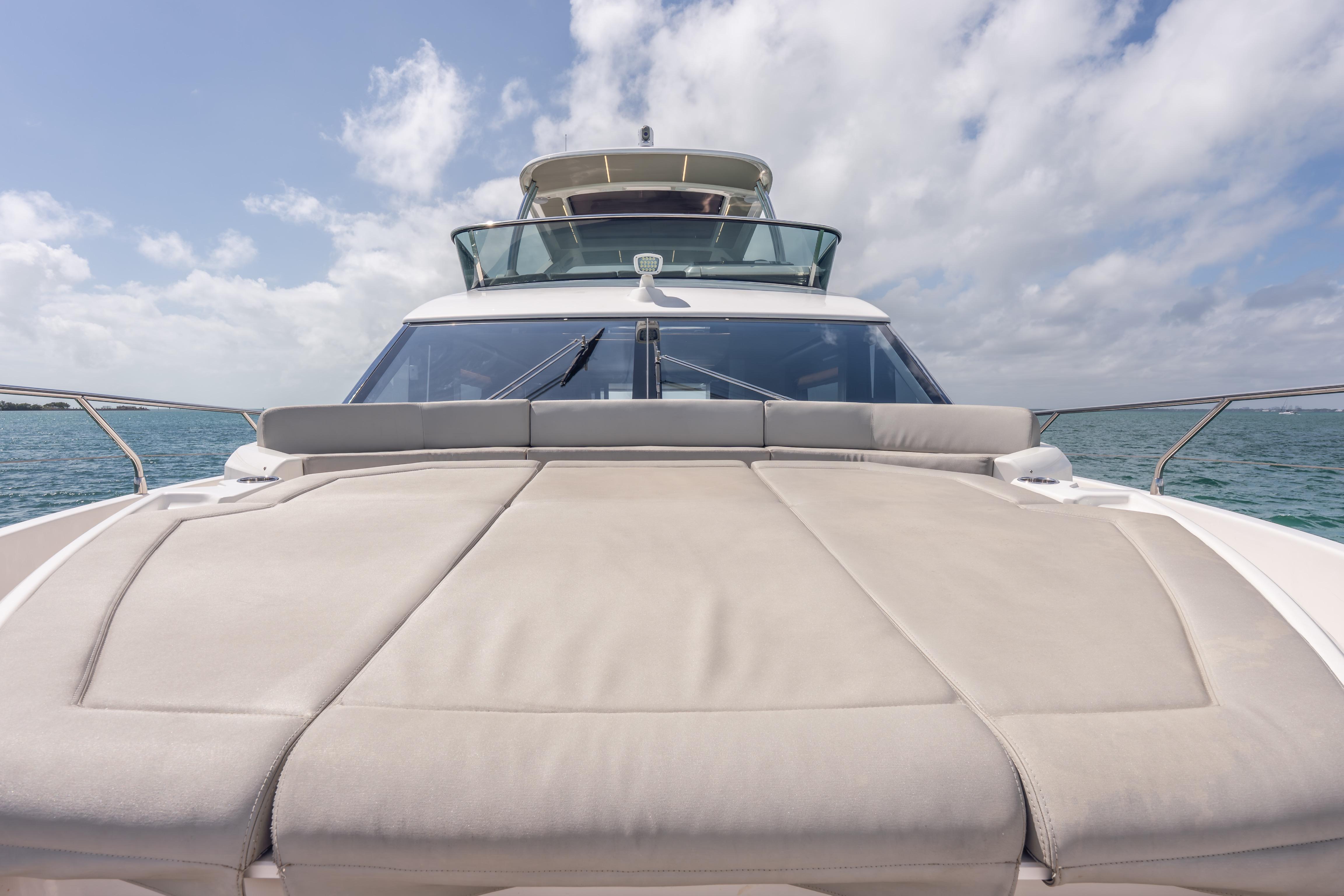 2019 Absolute 58 FLY yacht with spacious sun deck on open water.