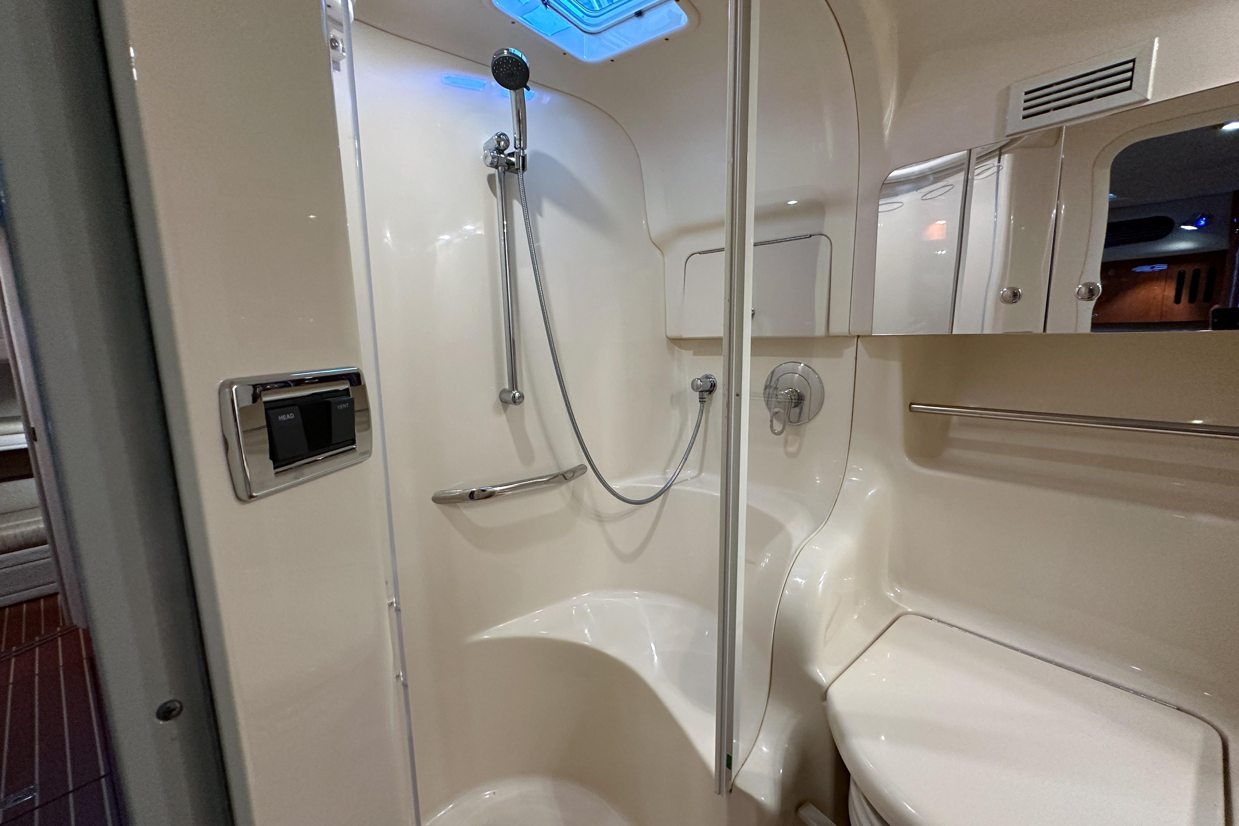 Luxurious bathroom in 2001 Sea Ray 410 Sundancer yacht, featuring modern shower and sleek design.