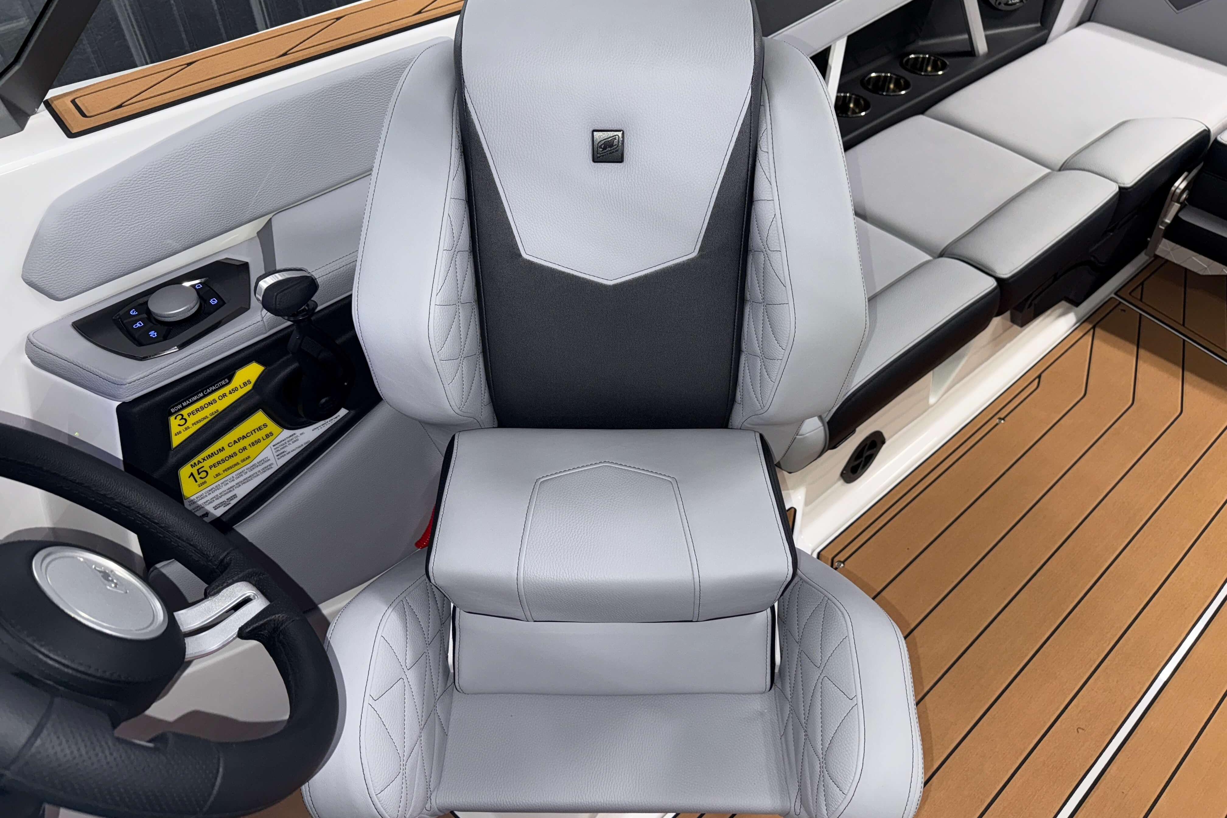 2026 Nautique Super Air Nautique GS22 interior with sleek captain's chair and modern controls.