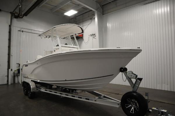 2025 Sea Fox 228 Commander boat on trailer in indoor storage.