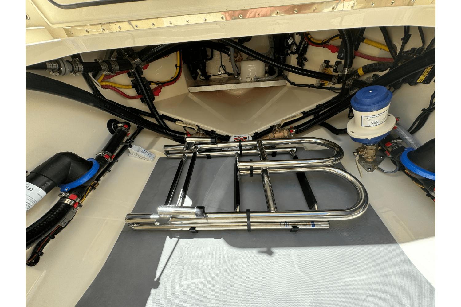 2024 Scout 357LXF boat interior showing mechanical components and wiring.