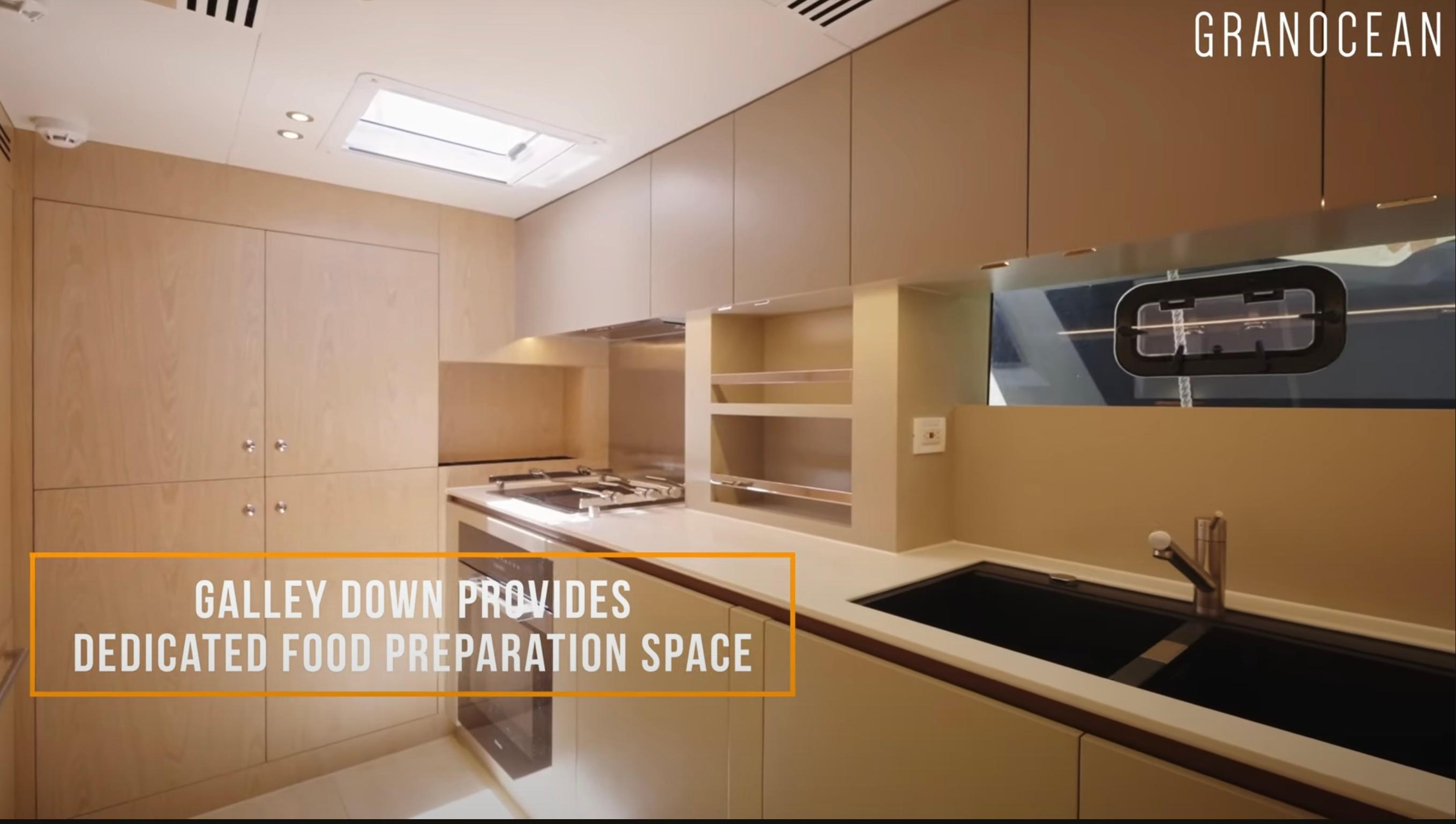 Modern galley kitchen in 2026 Granocean W-72 yacht, featuring sleek design and ample preparation space.