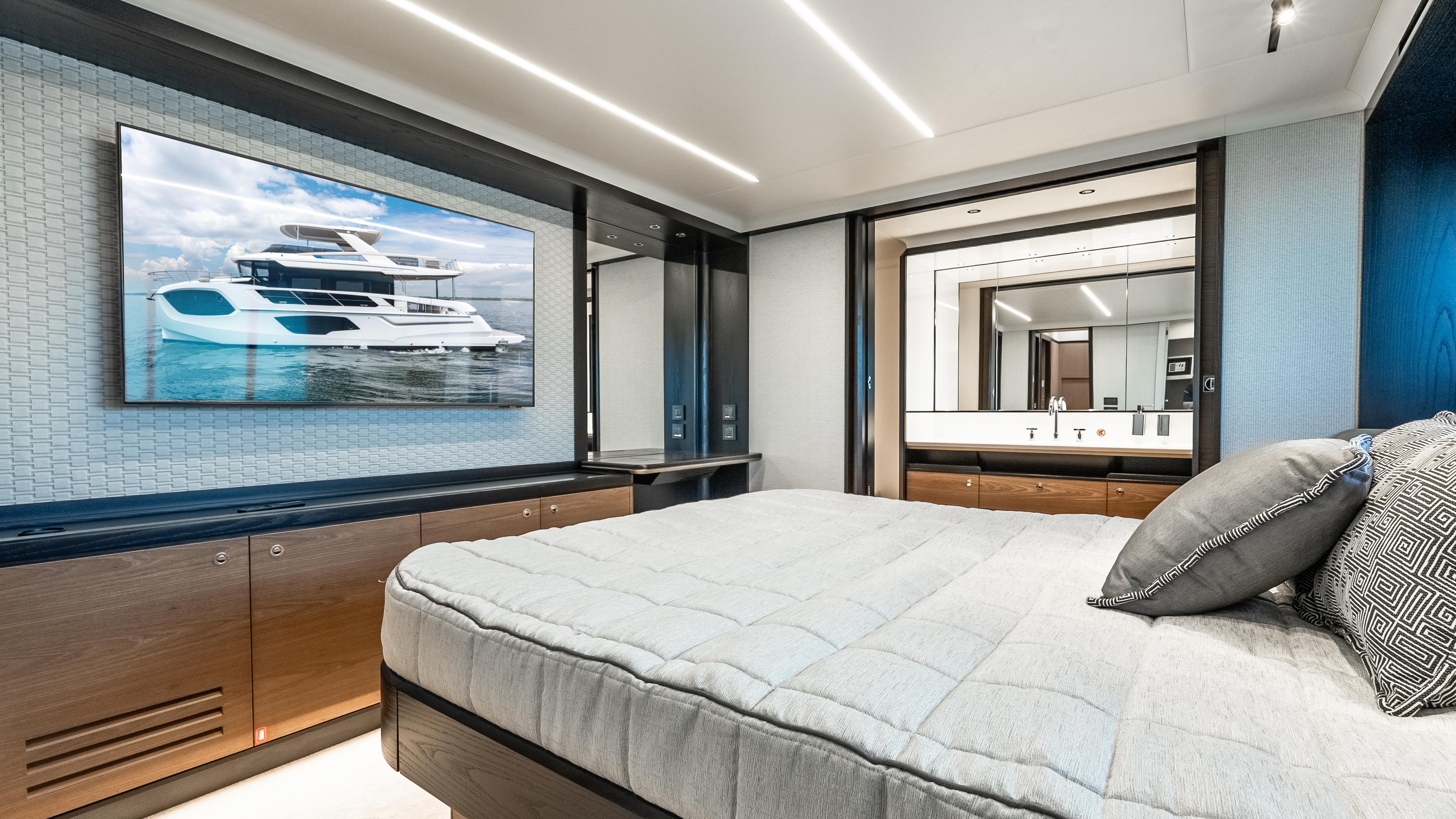 Luxurious bedroom interior of 2025 Absolute Navetta 64 yacht with modern design and elegant furnishings.