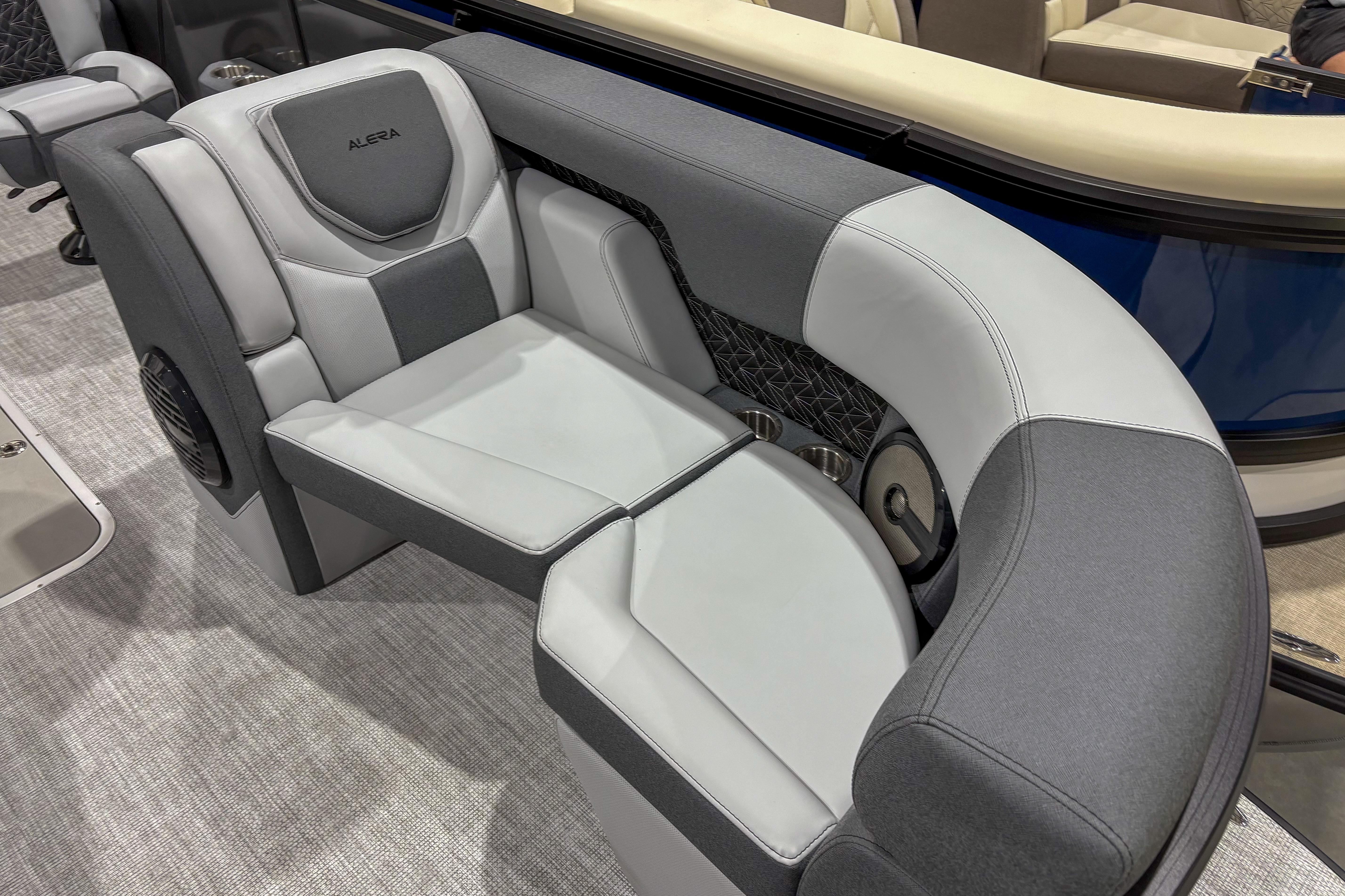 Luxurious seating on 2026 Alera M23L boat, featuring sleek gray upholstery and modern design.