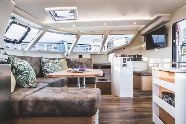 Luxurious Vision 444 yacht interior, 2026 model, featuring modern seating and elegant design.