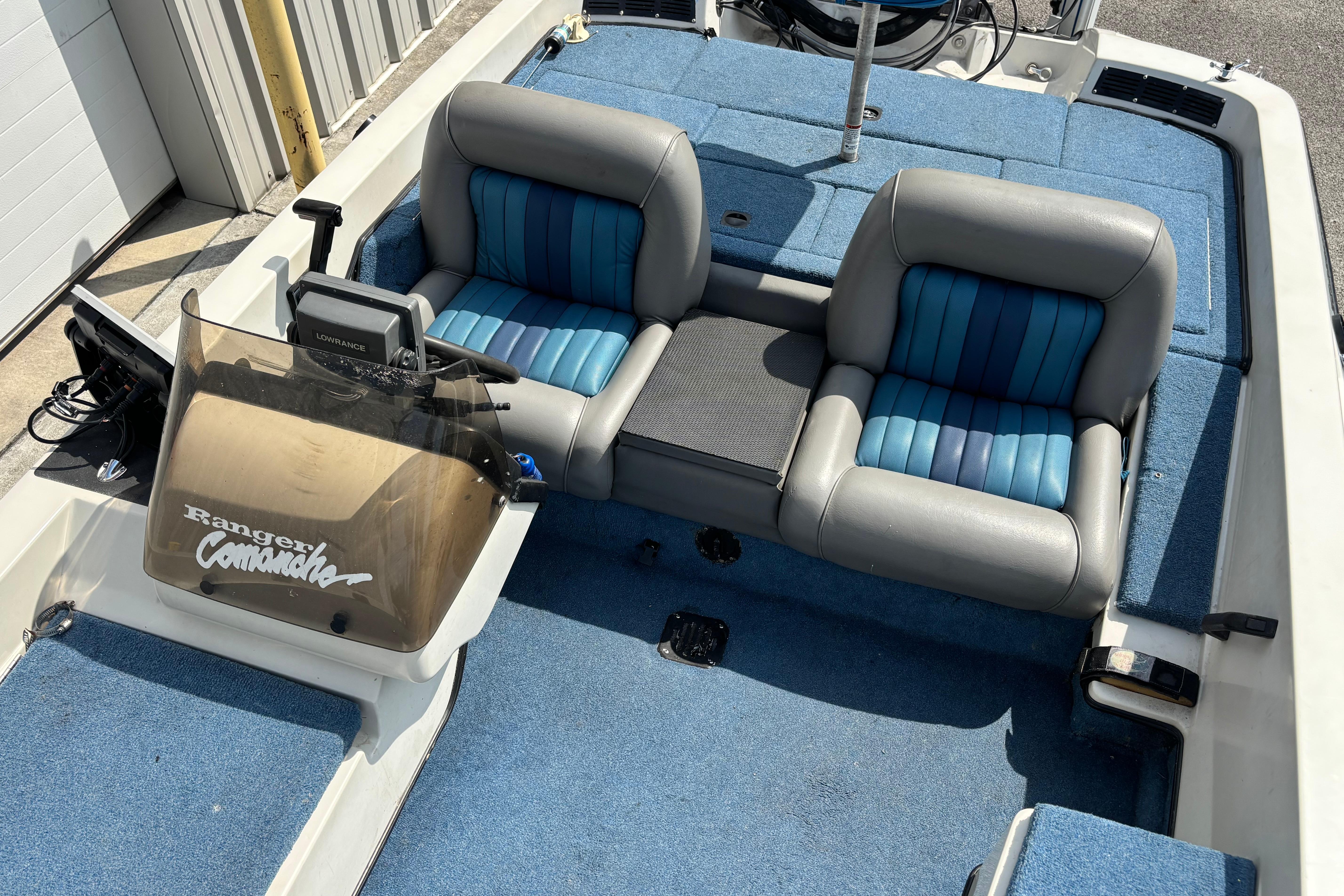 1991 Ranger 461VS boat interior with blue seats and console.
