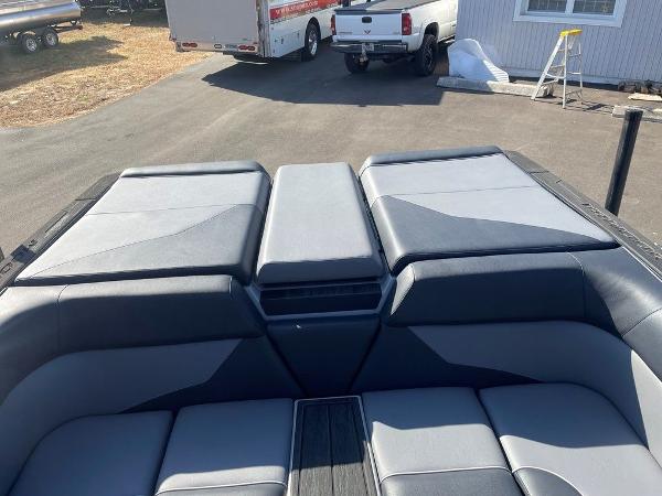 2025 Moomba Mondo boat interior with gray seating and storage compartments.