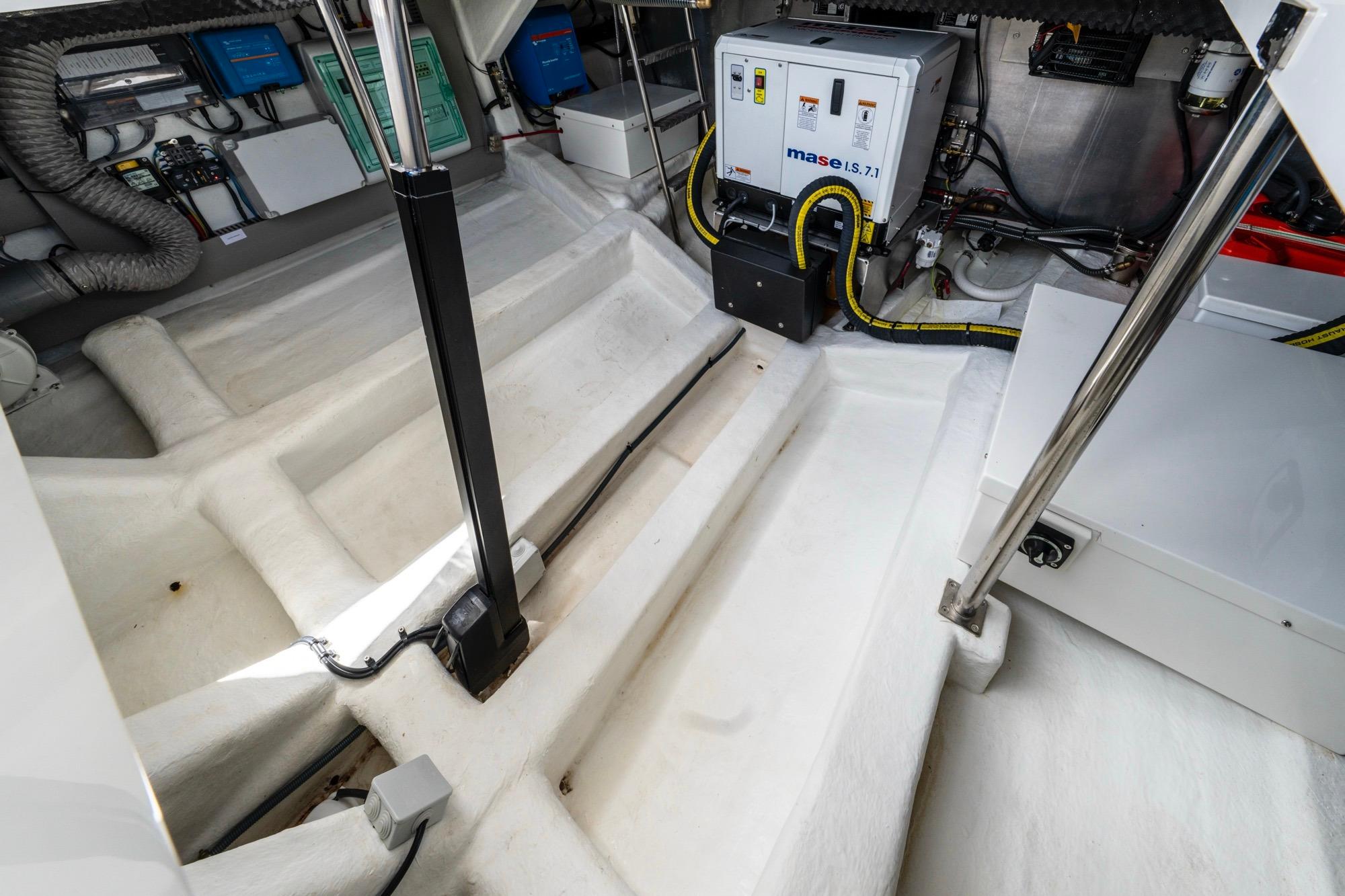 Engine room of 2024 Astondoa 377 Coupe, featuring Mase generator and electrical components.
