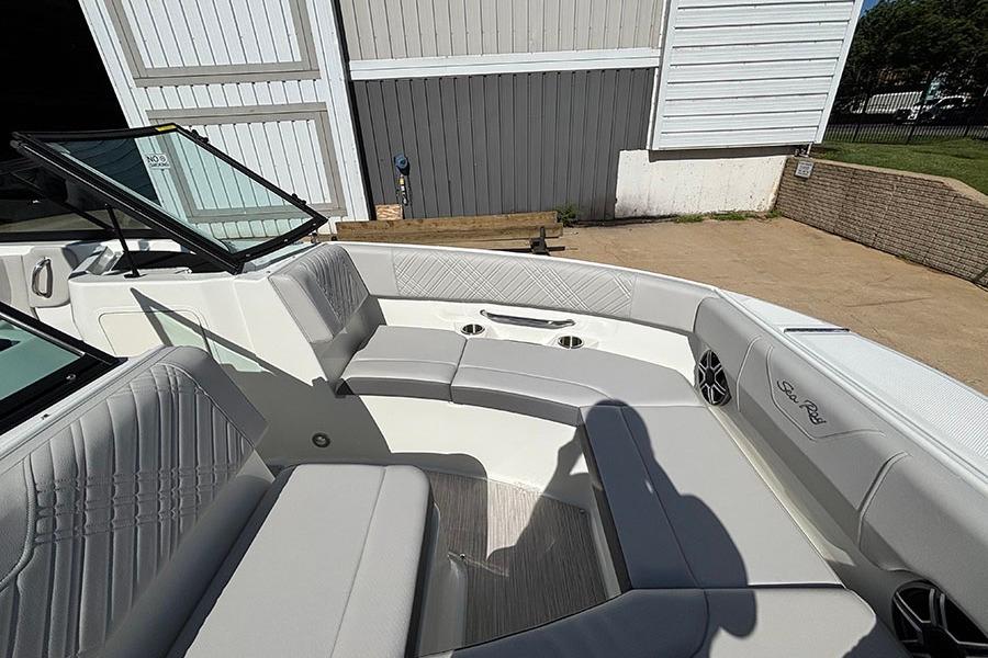2027 Sea Ray SDX 230 Outboard boat interior with gray seating and cup holders.