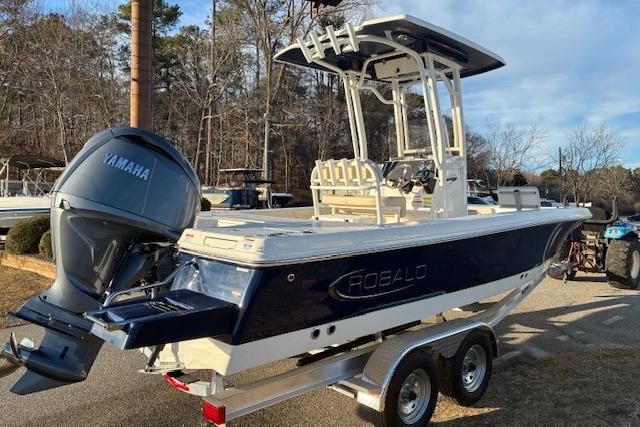 2026 Robalo 226 Cayman boat with Yamaha engine on trailer.